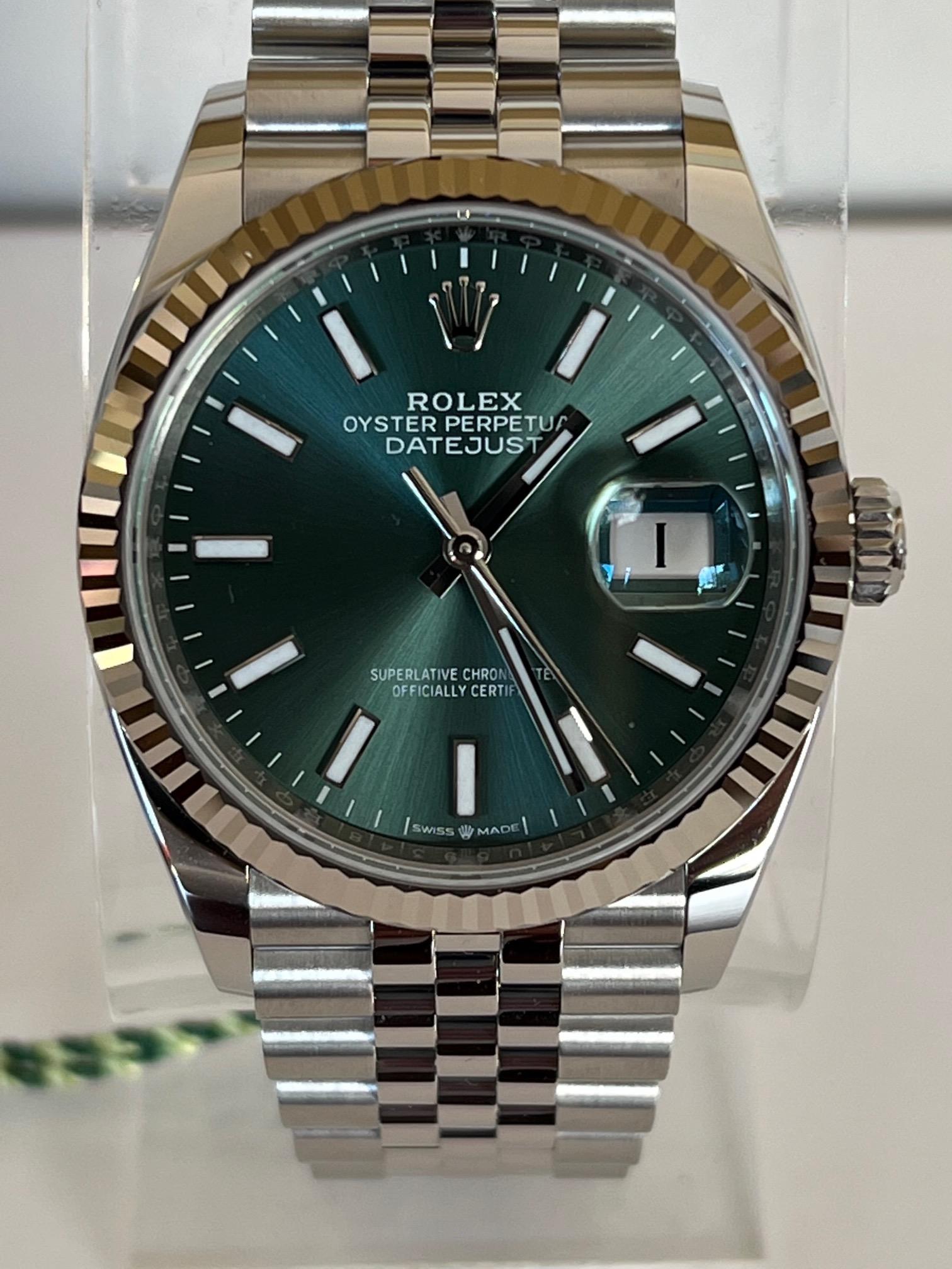 Brand: Rolex
Model Name: DateJust
Movement: Automatic
Case size: 36 mm
Case Back: Closed
Case Material: Stainless Steel
Bezel: 18k White Gold - Fluted Bezel
Dial: Mint Green
Bracelet: Stainless Steel - Jubilee Link
Hour Markers: Stick
Features: