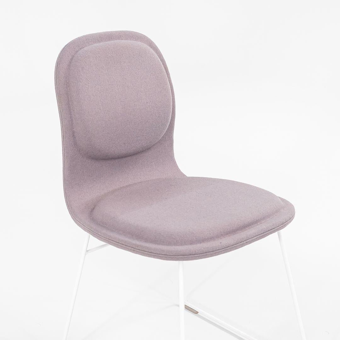 Listed for sale is a pair of Hi Pad dining chairs made with white stainless steel bases and grey fabric seats. The chairs were designed by Jasper Morrison and produced by Cappellini¬†in Italy. They date to circa 2022 and are guaranteed as