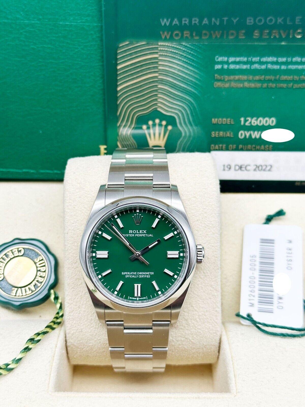 Style Number: 126000

Serial: 0YW21***

Year: 2022

Model: Oyster Perpetual 

Case Material: Stainless Steel 

Band: Stainless Steel 

Bezel: Stainless Steel 

Dial: Green 

Face: Sapphire Crystal 

Case Size: 36mm 

Includes: 

-Rolex Box &