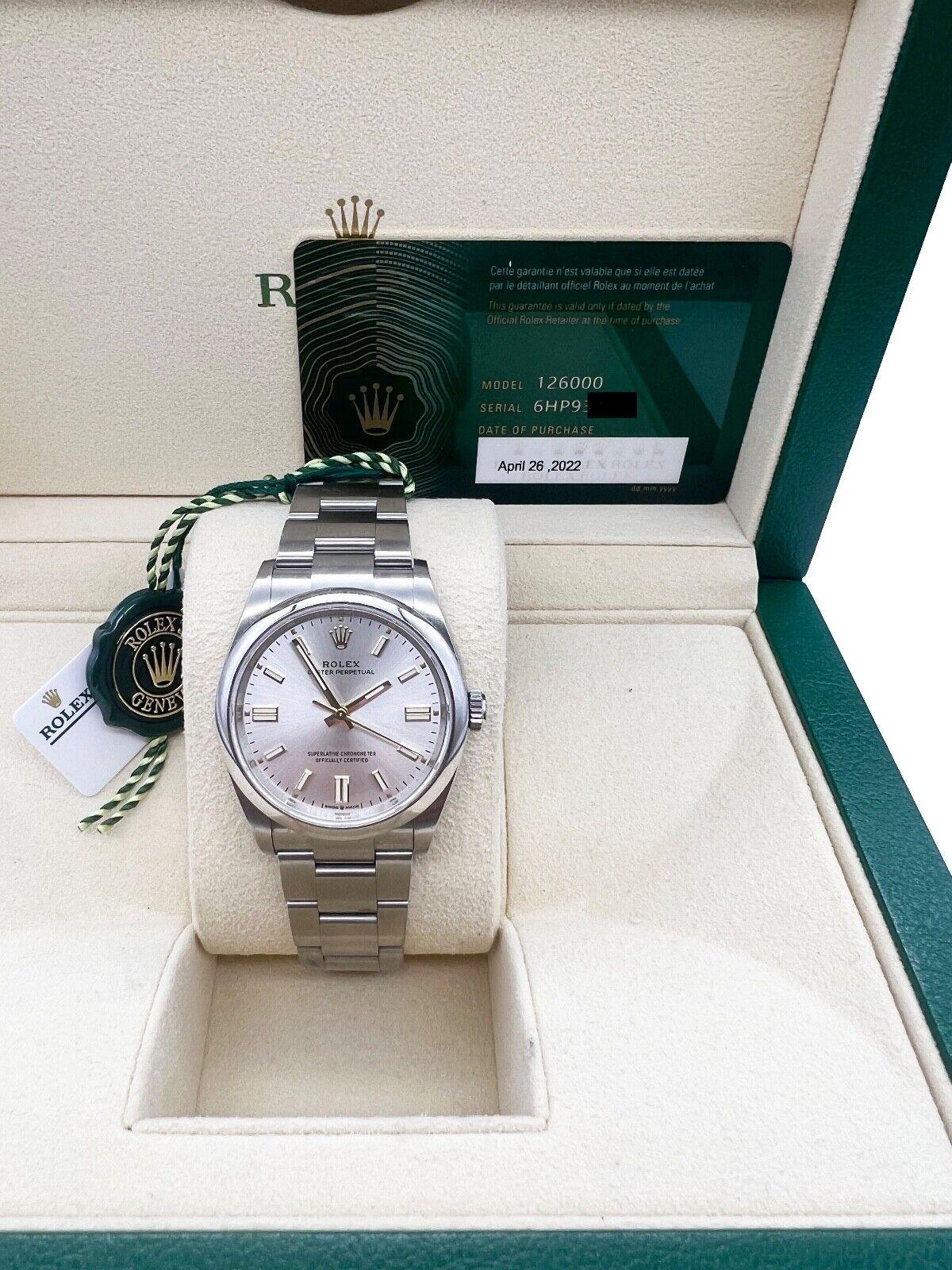 Style Number: 126000

Serial: 6HP93***

Year: 2022

Model: Oyster Perpetual

Case Material: Stainless Steel 

Band: Stainless Steel 

Bezel: Stainless Steel 

Dial: Silver

Face: Sapphire Crystal

Case Size: 36mm

Includes: 

-Rolex Box &