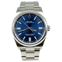 Rolex Oyster Perpetual Montre 2022, cadran bleu 126000, boîte en acier inoxydable et papier