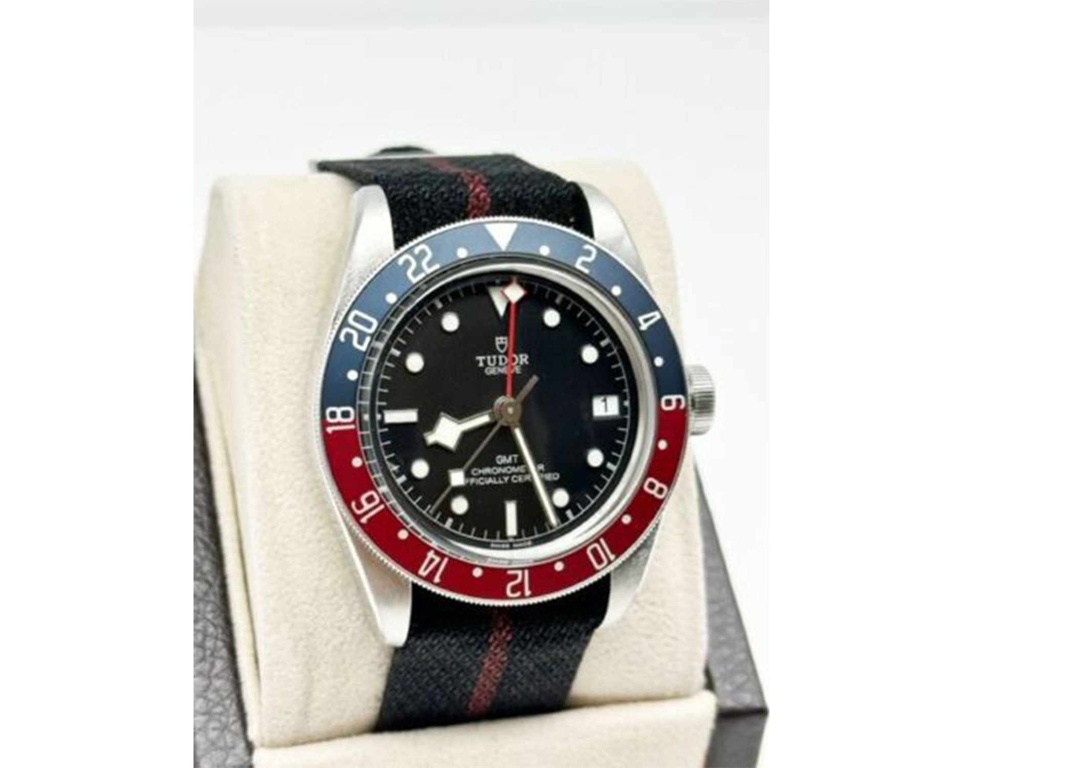 Style Number: 79830 
Serial: 9187***
Year: 2022
Model: Black Bay GMT
Case Material: Stainless Steel 
Band: Fabric
Bezel: Pepsi
Dial: Black
Face: Sapphire Crystal 
Case Size: 41mm 

Includes: 

-Tudor Box & Paper

-Certified Appraisal 

-5 Year