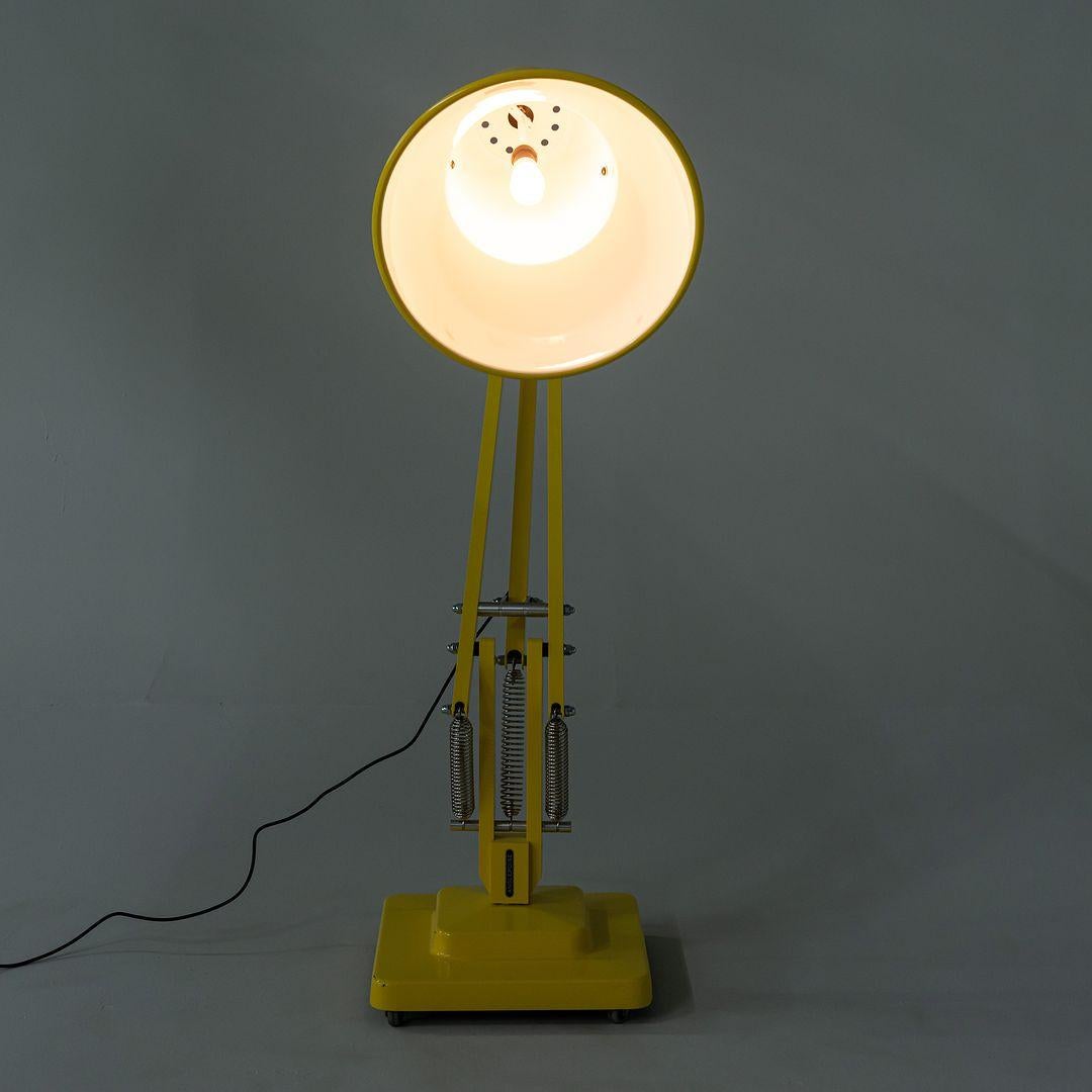 This is an Original 1227 Giant Floor Lamp, designed by George Carwardine. This particular example was produced by Anglepoise in 2023. The lamp is comprised of aluminum components (shade, arms, bridle, spacers, and force block) and a cast aluminum