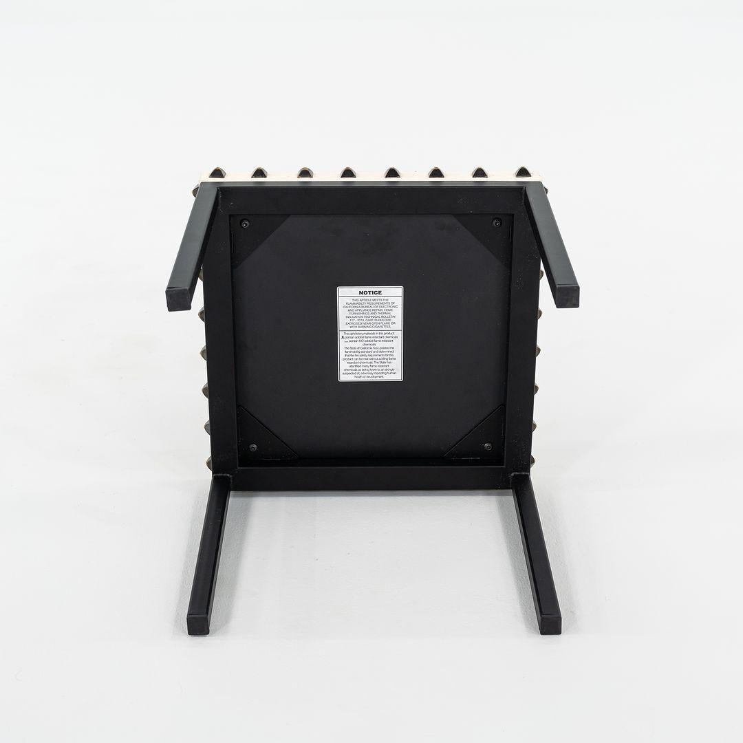 This is a Not a Harem small side table, originally designed by Annabel Karim Kassar in 2021. This particular example was produced by Moroso in Italy circa 2023. The table is comprised of a steel base with a powder coat finish, steel studs along the