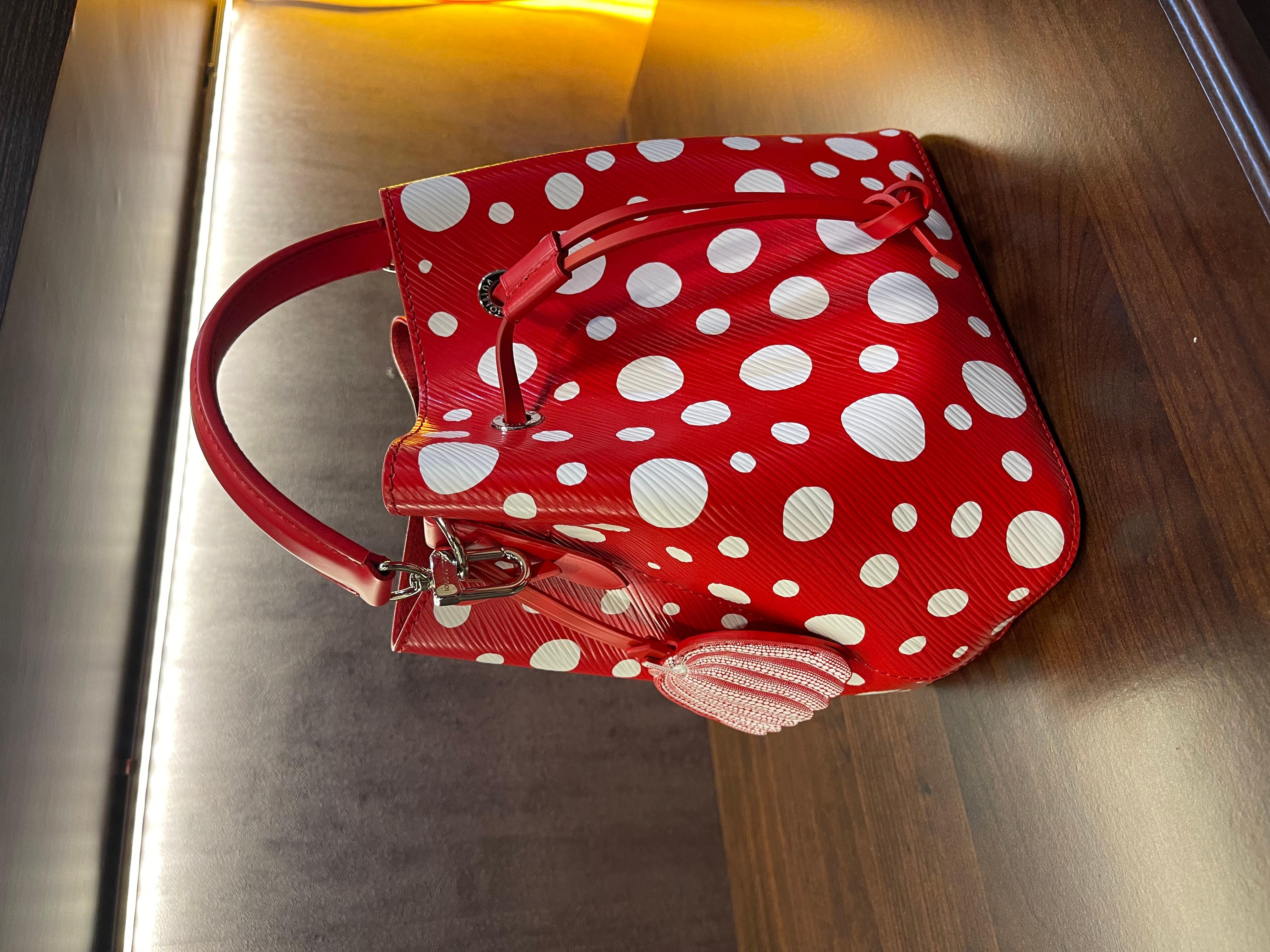 Rare collectible LV collaboration with Yayoi Kusama from the 2023 collection. In brand new condition. Beautiful small bucket bag with cute polkadot and pumpkin tag design.