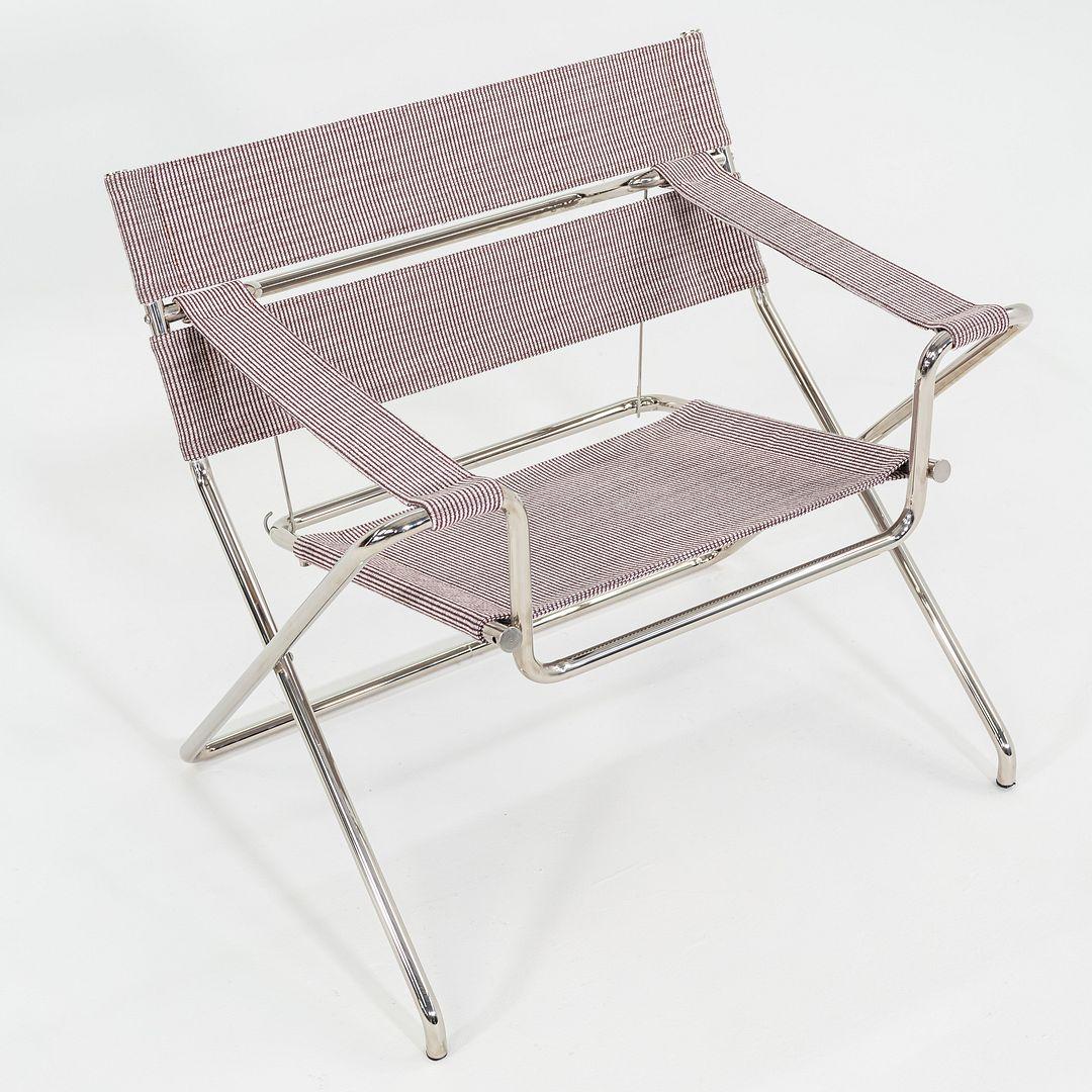 Si tratta di una sedia da salotto pieghevole D4, originariamente progettata da Marcel Breuer nel 1926. Questo particolare esemplare è stato prodotto da Tecta in Germania C. 2023. La sedia è composta da una struttura in tubolare d'acciaio e da una