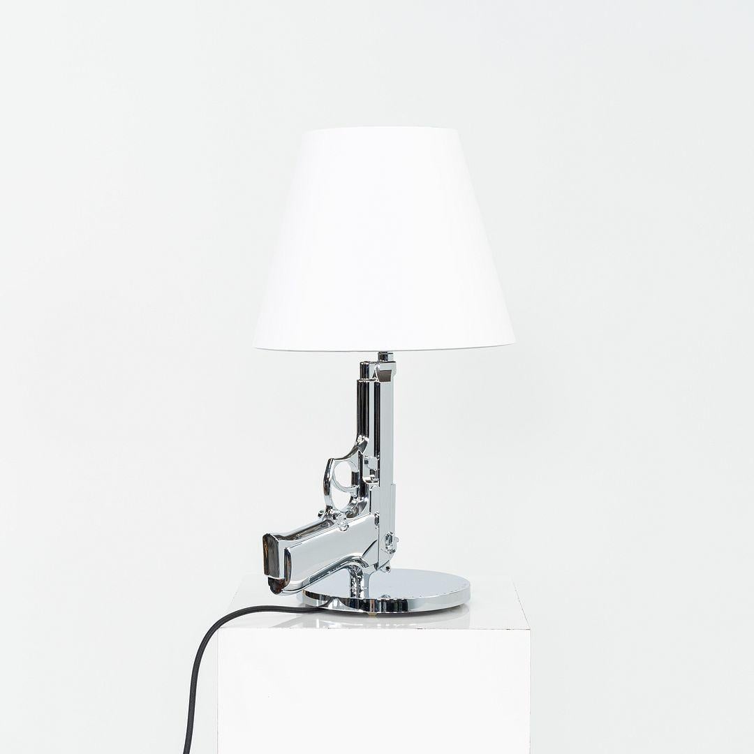 Italian 2023 Philippe Starck for Flos Bedside Gun Table Lamp in Chrome with White Shade For Sale