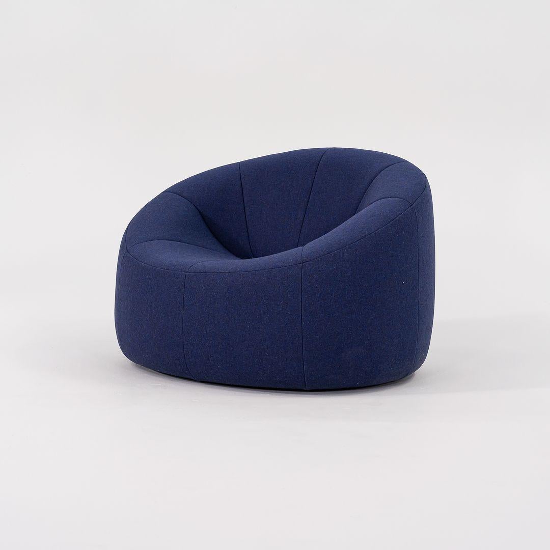 Listed for sale is a Pumpkin Armchair made of an ABS base and polyether foam covered in a blue Divina Melange cobalt wool fabric. The chair was designed by Pierre Paulin and produced by Ligne Roset¬†in France. It was made circa 2023 and is