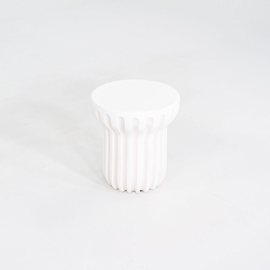 This is a Radian Tall Occasional Table, originally designed by Cedric Ragot. This particular example was produced by Roche Bobois in France in 2023. The table is comprised entirely of enameled ceramic. 
 

 The table measures 15.75 inches in