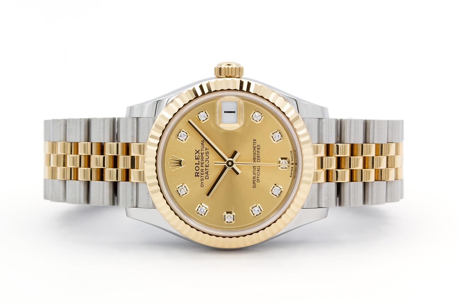 We are pleased to offer this 2023 Rolex Datejust 278273, still under factory warranty through March 2028. It features a 31mm stainless steel case, Rolex factory champagne 10 diamond dial with yellow gold markers and hands, Rolex factory 18k yellow