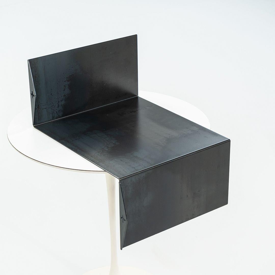 This is a Z-shelf (right), originally designed by Ron Arad. These examples were produced by Moroso in Italy circa 2023. The shelves are made completely of black sheet steel. The listed price includes a set of four shelves, and there are two sets