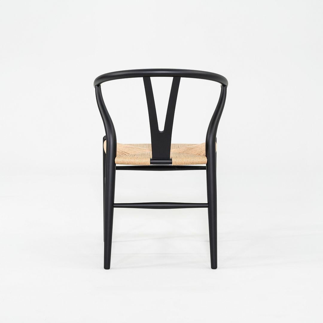 2023 Set of Four Carl Hansen Hans Wegner CH24 Wishbone Dining Chairs in Black In Excellent Condition In Philadelphia, PA