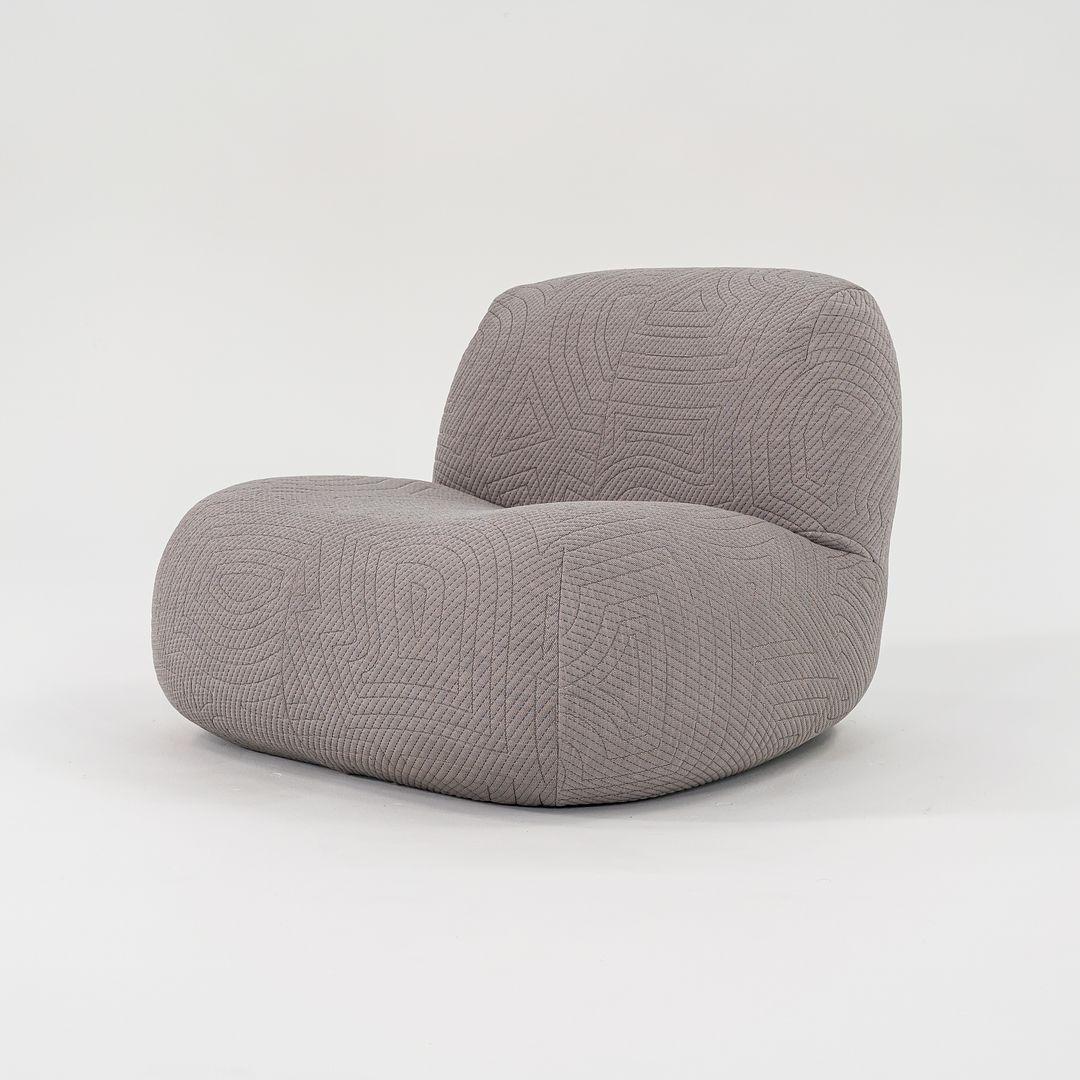 Listed for sale is a Pukka Armchair made of polyether foam covered in a grey wool knit Appa Ulster fabric upholstery. The chair was designed by Yabu Pushelberg and produced by Ligne Roset¬†in France. It was made circa 2023 and is guaranteed as