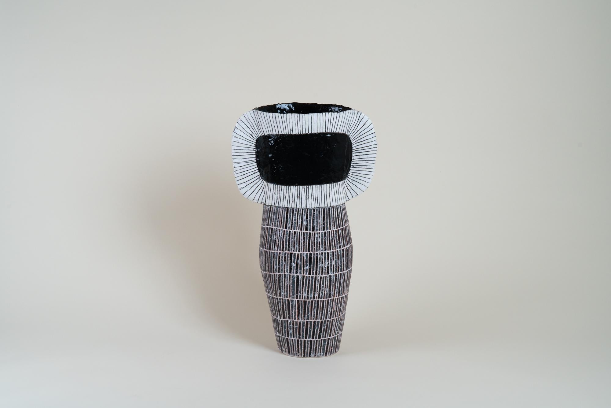 Louise Gelderblom is a South African ceramic artist known for her distinctive, large-scale hand-built vessels and sculptural forms. Based in Cape Town, she combines traditional craftsmanship with contemporary aesthetics, often drawing inspiration