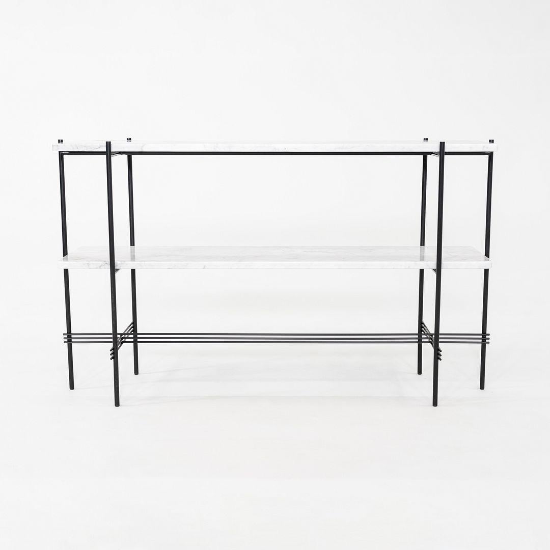 This is a TS Console, originally designed by GamFratesi for GUBI in 2014. This particular example was produced in Italy in 2024. The console is comprised of a powder coated steel base with white marble shelves.
 
 The console measures 11.8 inches