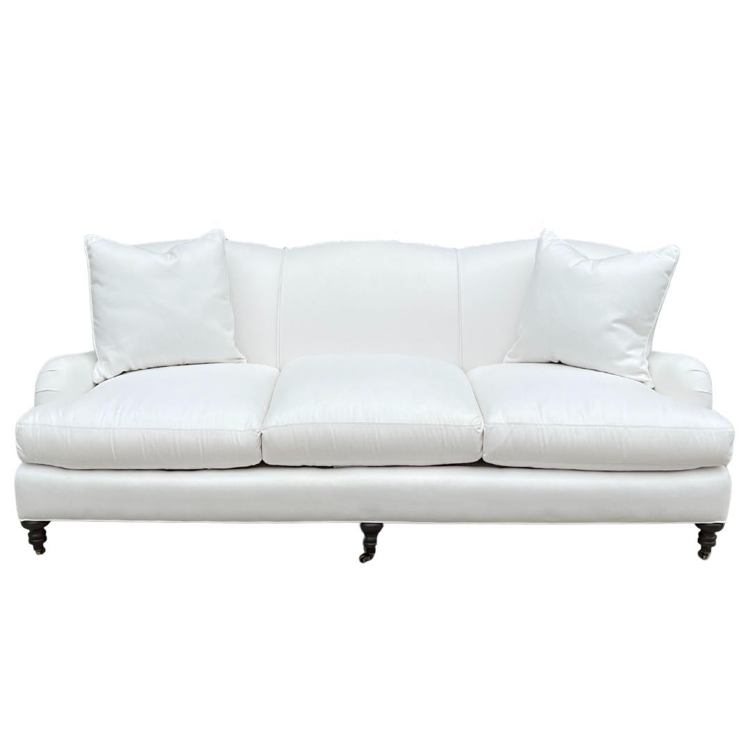 Custom made LEE Industries 3278-03 Sofa. This sofa is showroom new and has never been used.

A distinctive profile that nods to 18th century English design. Featuring roll arms and front turned legs with casters. The tight back seat has a slight