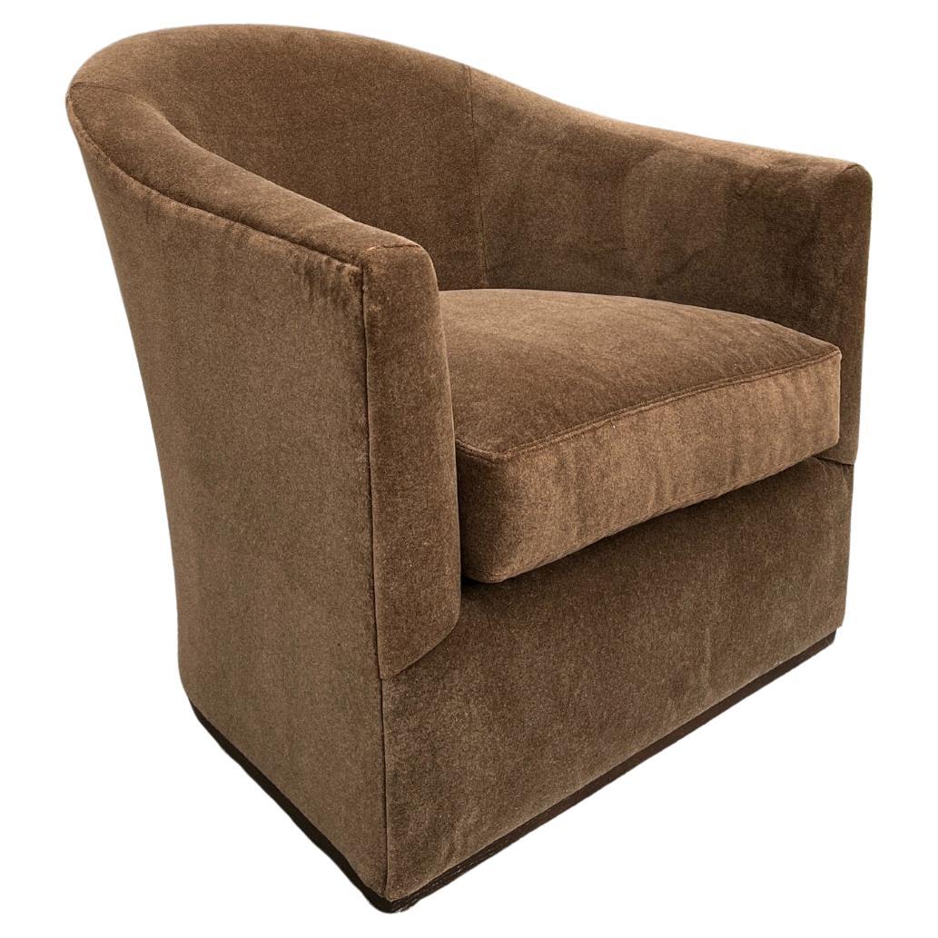 Custom made Lee Industries 5702-01 Swivel Chair (2 available). These chairs are showroom new and have never been used.

This chair has a softly curved back and is trimmed with a small line of wood around its base. A beautiful silhouette from any