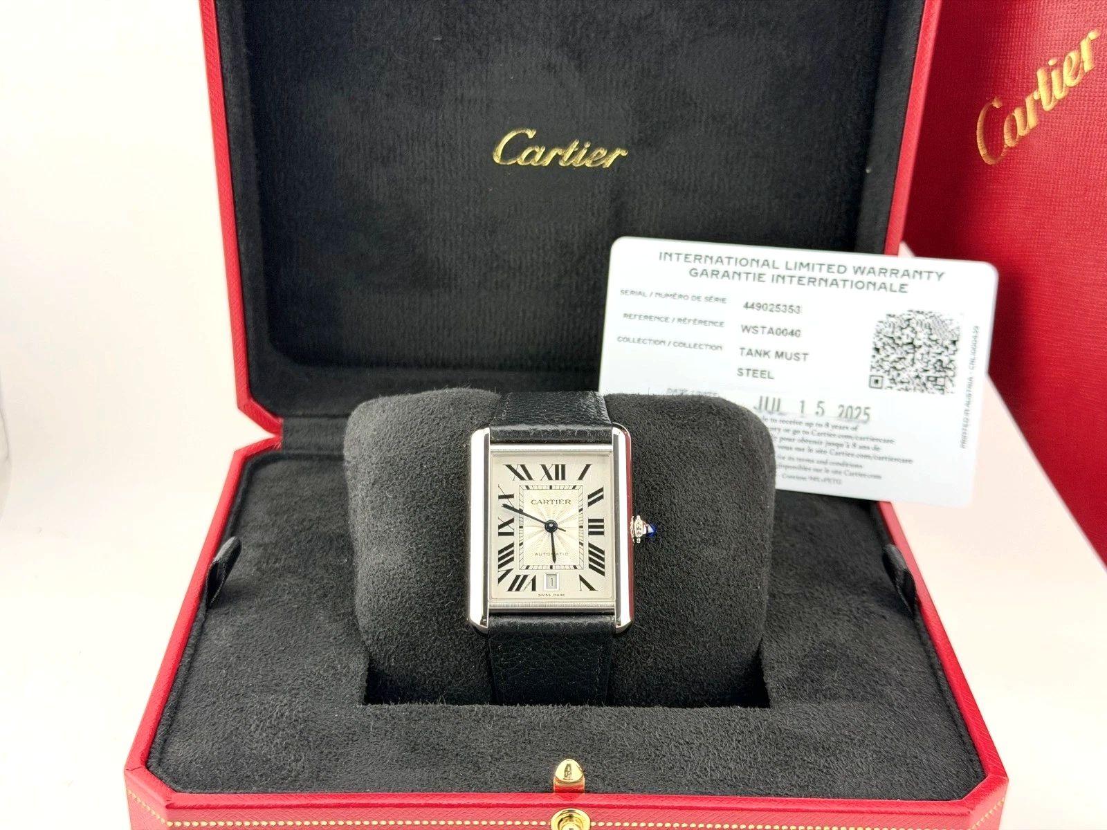 Style Number: WSTA0040



Serial: 4490253*****



Year: 2025

 

Model: Cartier Tank Must De Cartier XL

 

Case Material: Stainless Steel 

 

Band: Black Leather 

 

Bezel: Stainless Steel  

 

Dial: Silver Roman Numeral Dial 

 

Face: Silver


