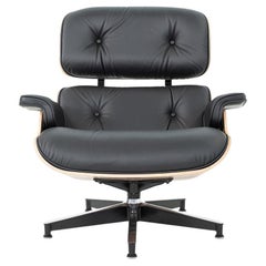 2025 Herman Miller Eames Lounge Chair and Ottoman in Walnut with Black Leather