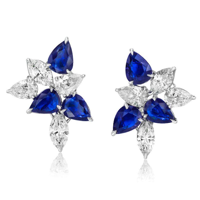 The Classic Cluster Earring. Redefined. Set with Sapphires and Diamonds and Set in Platinum and 18 Karat White Gold.
Sapphires totaling 5.84 Carats.
Diamonds Totaling 4.18 Carats.
10.02 Carats Total

Ring
Sapphires totaling 3.12 Carats.
Diamonds
