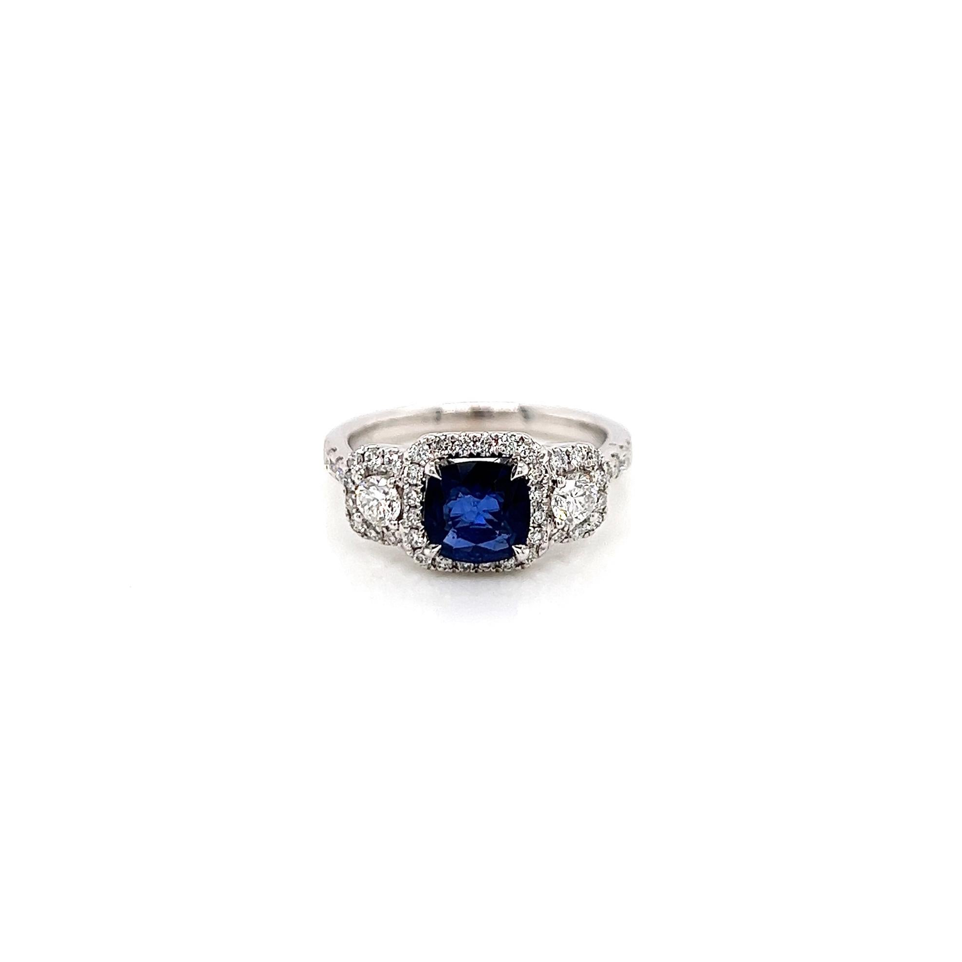 2.02 Total Carat Sapphire Diamond Engagement Ring

-Metal Type: 18K White Gold
-1.24 Carat Cushion Cut Blue Sapphire
-0.78 Carat Round Side Natural Diamonds, F-G Color, VS-SI Clarity
-Size 6.75

Made in New York City