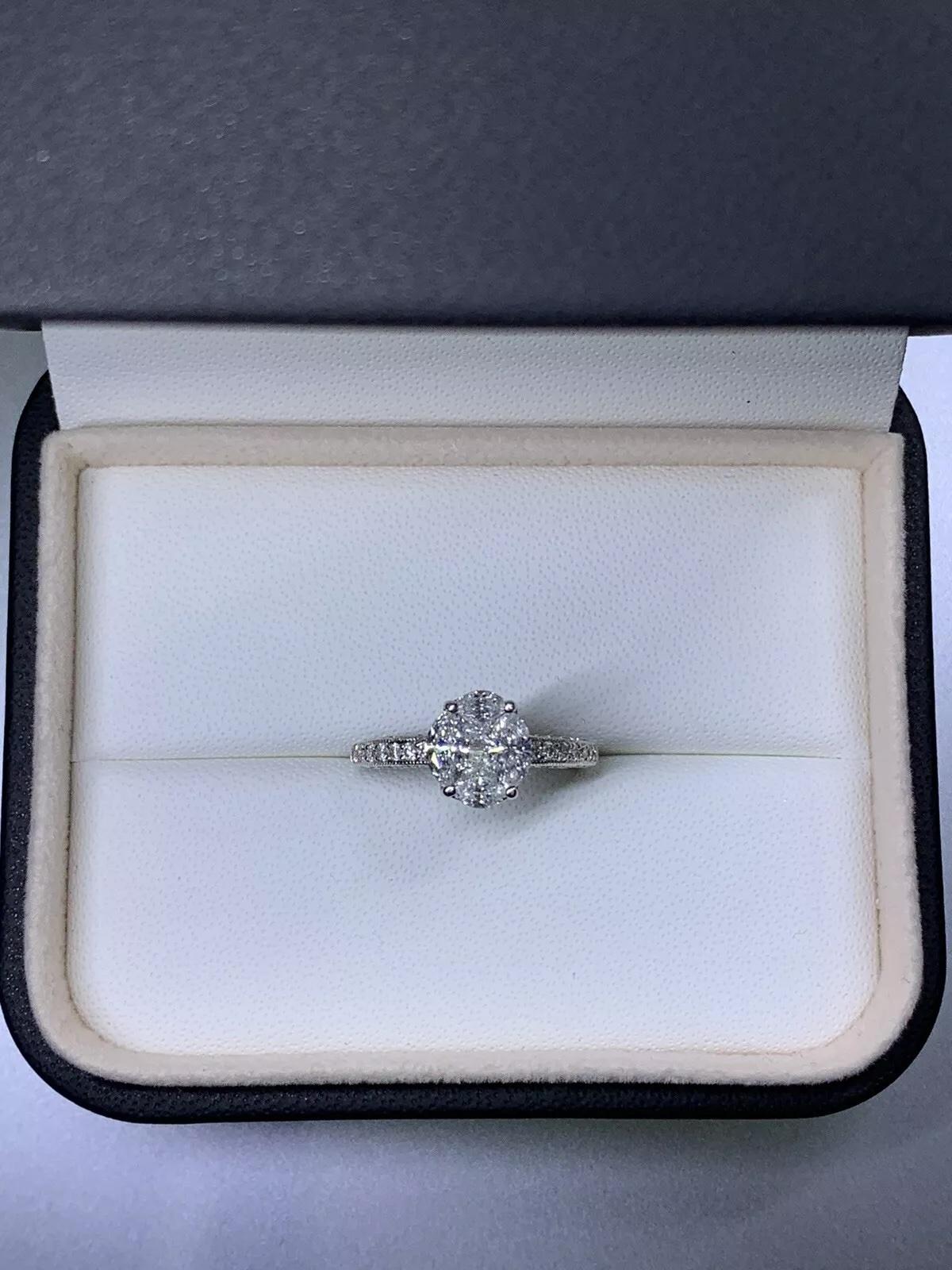 2.02ct marquise and princess diamond engagement ring invisible set halo in 18ct white gold

Princess and marquise diamonds cut solitaire engagement ring wedding band.

The ring can be resized

Centre diamond weight 1.62ct F colour VS1