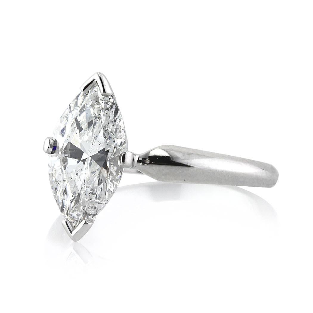 This stunning solitaire diamond engagement ring showcases a superb 2.02ct marquise cut diamond, AGS certified at E-SI2. It is exquisitely hand set in 14k white gold.