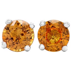 Orecchini solitari con zaffiro arancione rotondo da 2,02 carati in oro bianco 14k