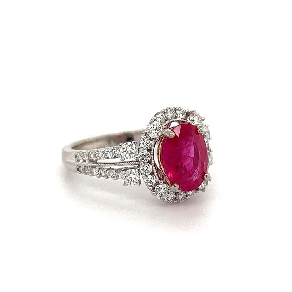 Simply Beautiful! Finely detailed GIA Burma Ruby and Diamond Platinum Ring. Centering a securely nestled Oval Burma Ruby weighing approx. 2.03 Carat. GIA lab report # 5221073272. Surrounded by Diamonds, approx.0.75 total Carat weight, including