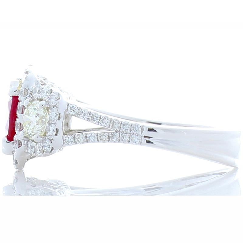 This blood red ruby ring will stop you in your tracks with its seductive color. A 2.03 carat, cushion cut, measuring 7.33 x 7.26 mm, ruby is from Thailand. Its color is blood red, evenly distributed through the gem. It has character, just stare at