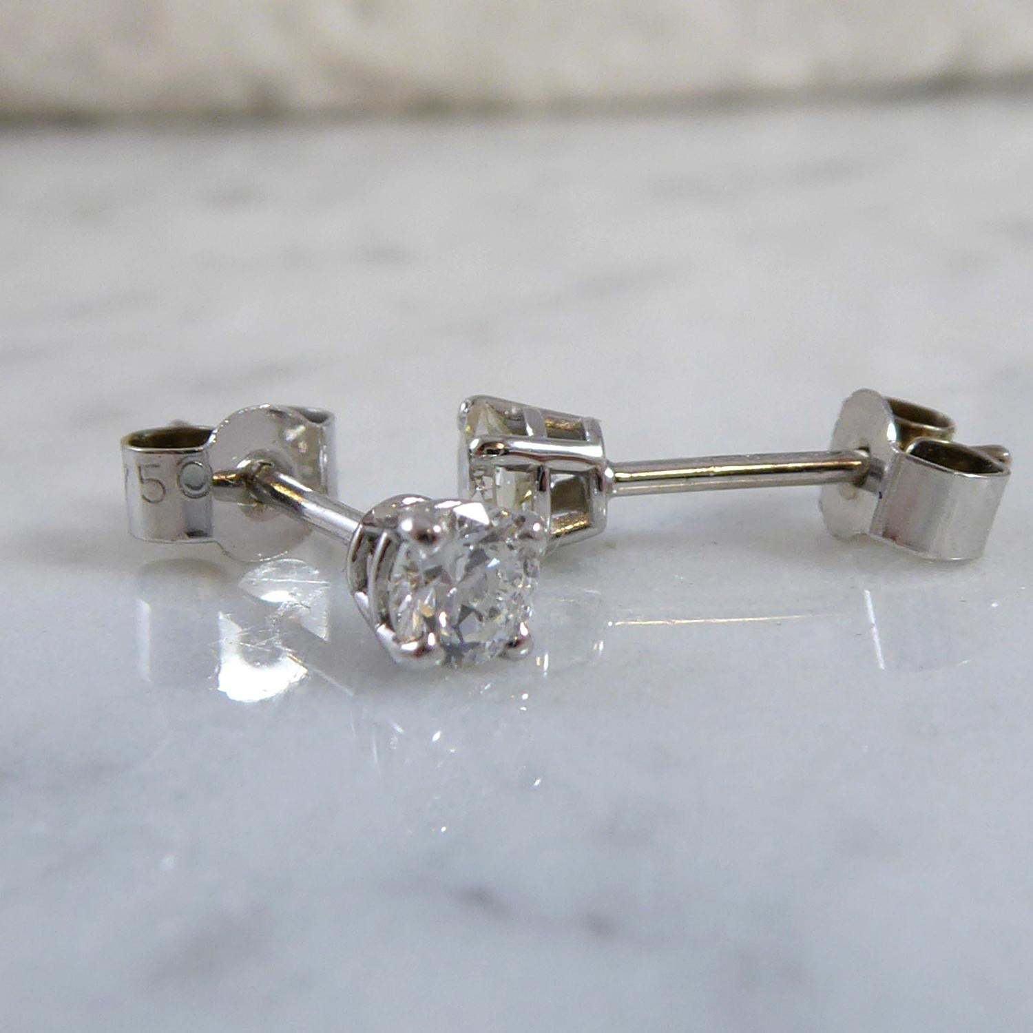 A pair of pre-owned modern brilliant cut diamonds which we have reset into new platinum mounts.  The diamonds are round modern brilliant cut and set in platinum four claw settings  to post and alpha style back fittings.  Measuring approx. 6.30mm and