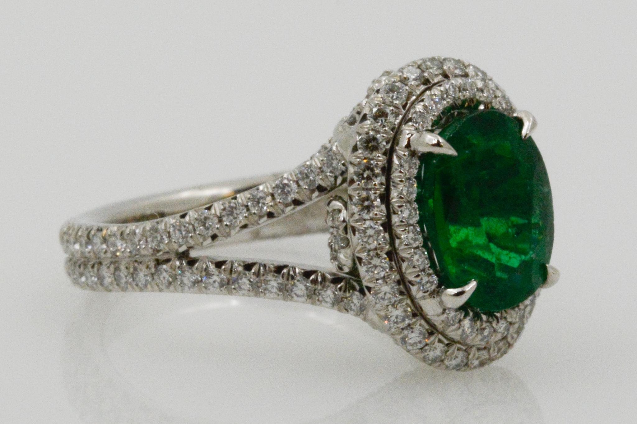 Modern 2.03 Carat Emerald and Diamond Halo Platinum Ring