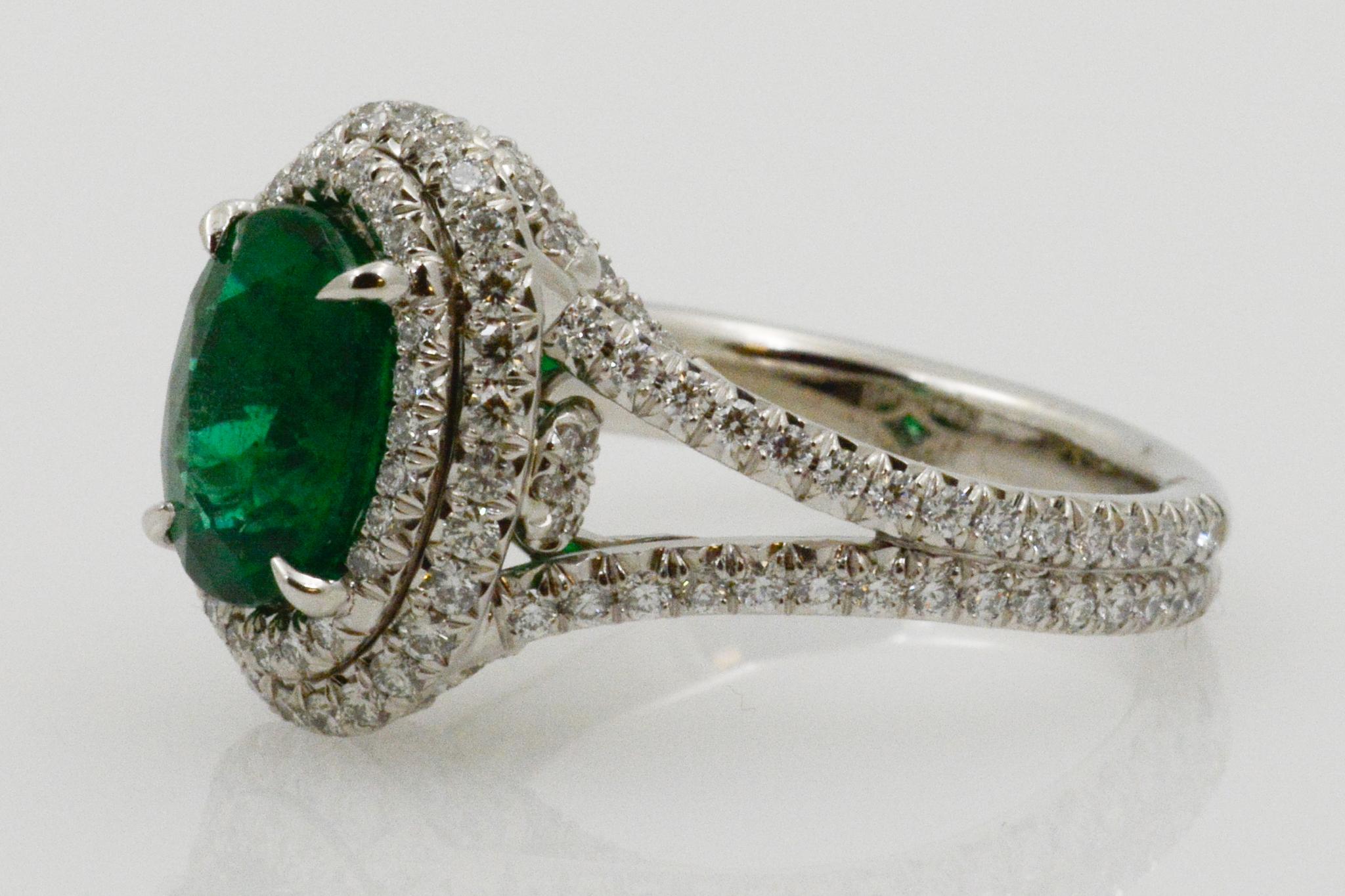 Oval Cut 2.03 Carat Emerald and Diamond Halo Platinum Ring