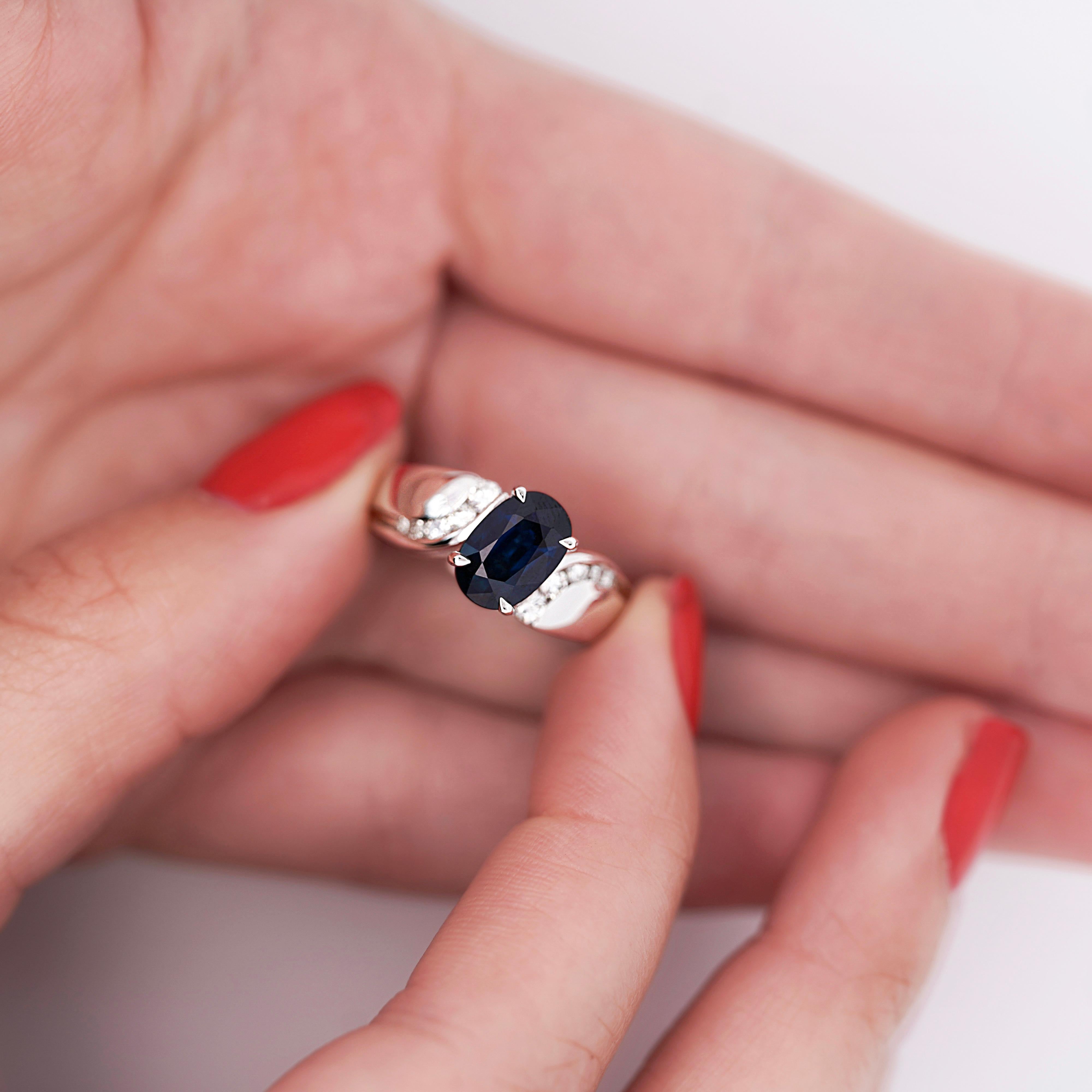 Women's 2.03 Carat Oval Cut Sapphire with Diamond Accent Bypass Platinum Ring For Sale