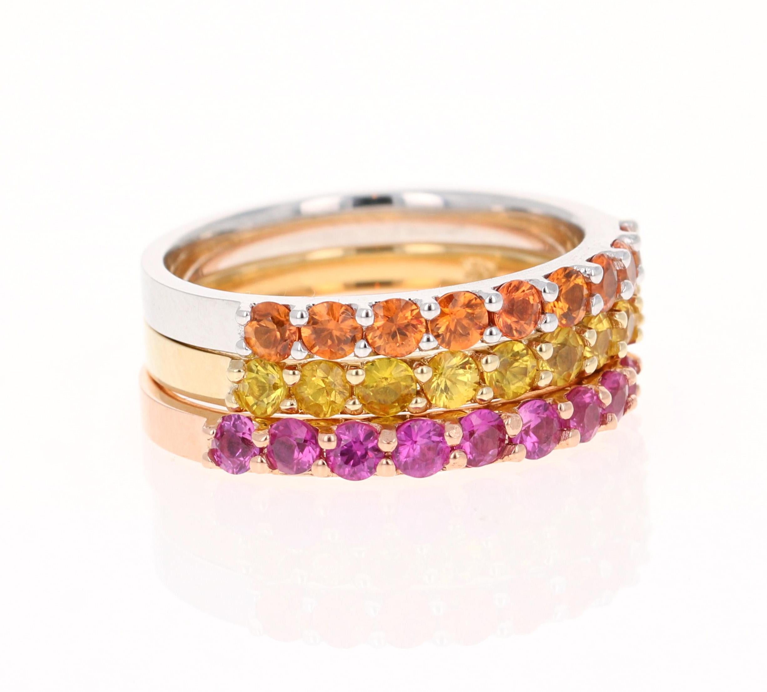 Set of 3 elegant and classy 2.03 Carat Sapphire bands that are sure to be a great addition to your accessory collection! There are 9 Round Cut Sapphires (Pink, Yellow and Orange Sapphires) in each band that weigh approximately 0.67 Carats each.  The