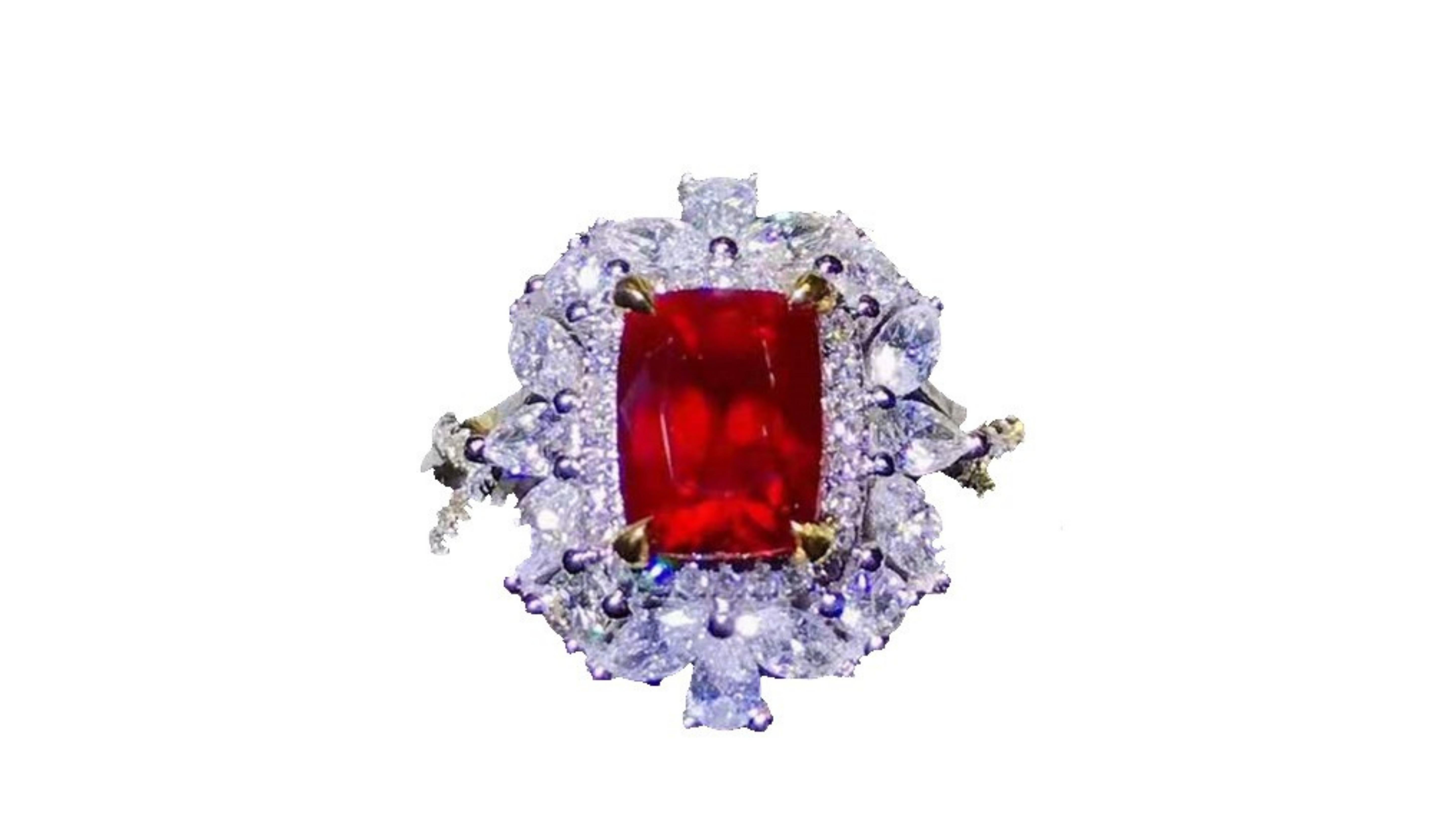 
2.03 Carat Ruby Pigeon Red Blood Ring  with 66 White Diamonds in a Vintage Style   and ones around the centre stone are 1.21 Carat . Set in 18 Karat White Gold.  Its also unheated where most ruby stones are.  This one is from Mozambique and we have