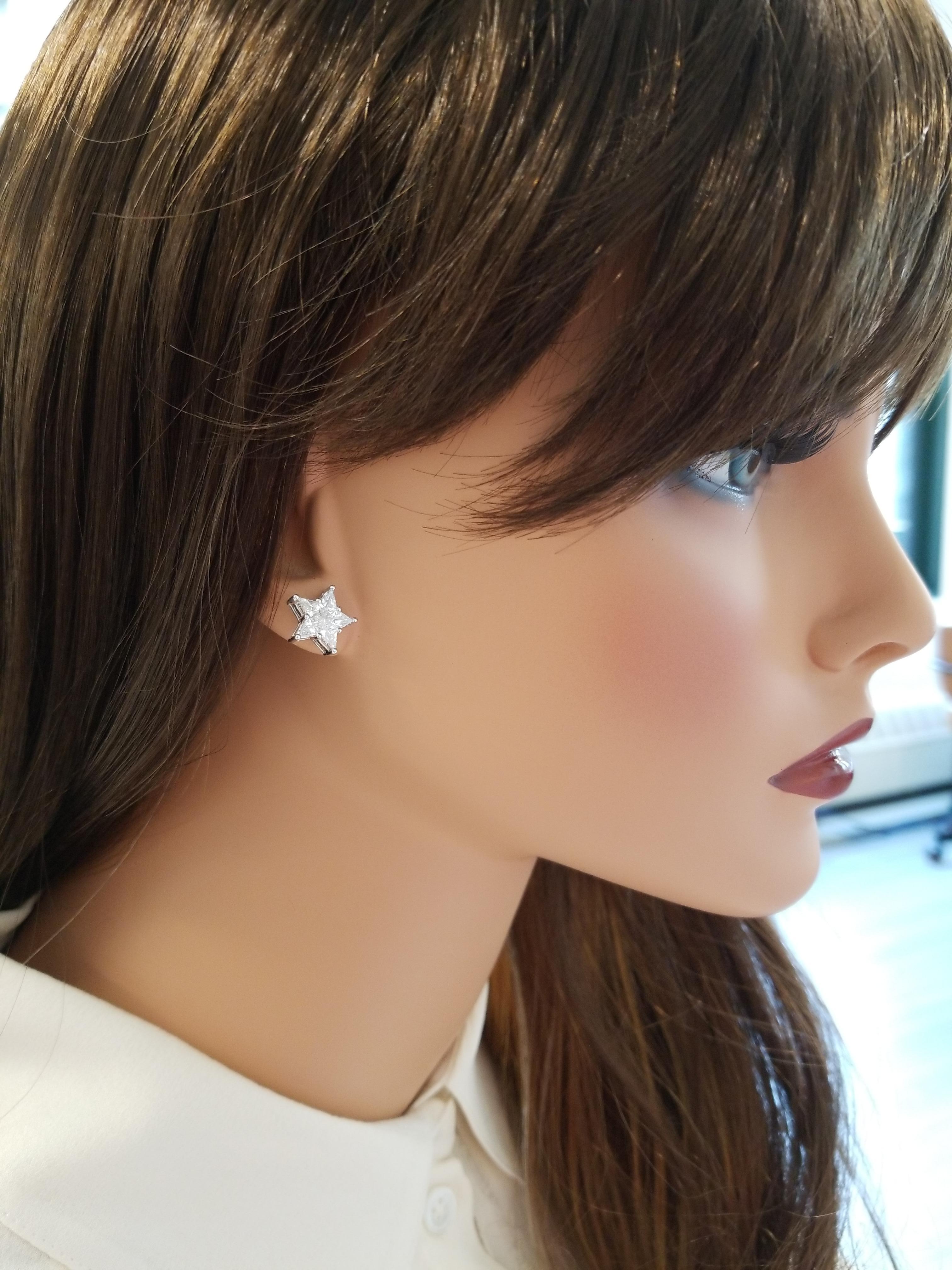 These are distinct stud earrings that feature 10 kite-shaped diamonds arranged in a scintillating star shape totaling 2.03 carats. The diamonds are invisible set, so there is no metal between the diamonds. Created in brightly polished 18 K white