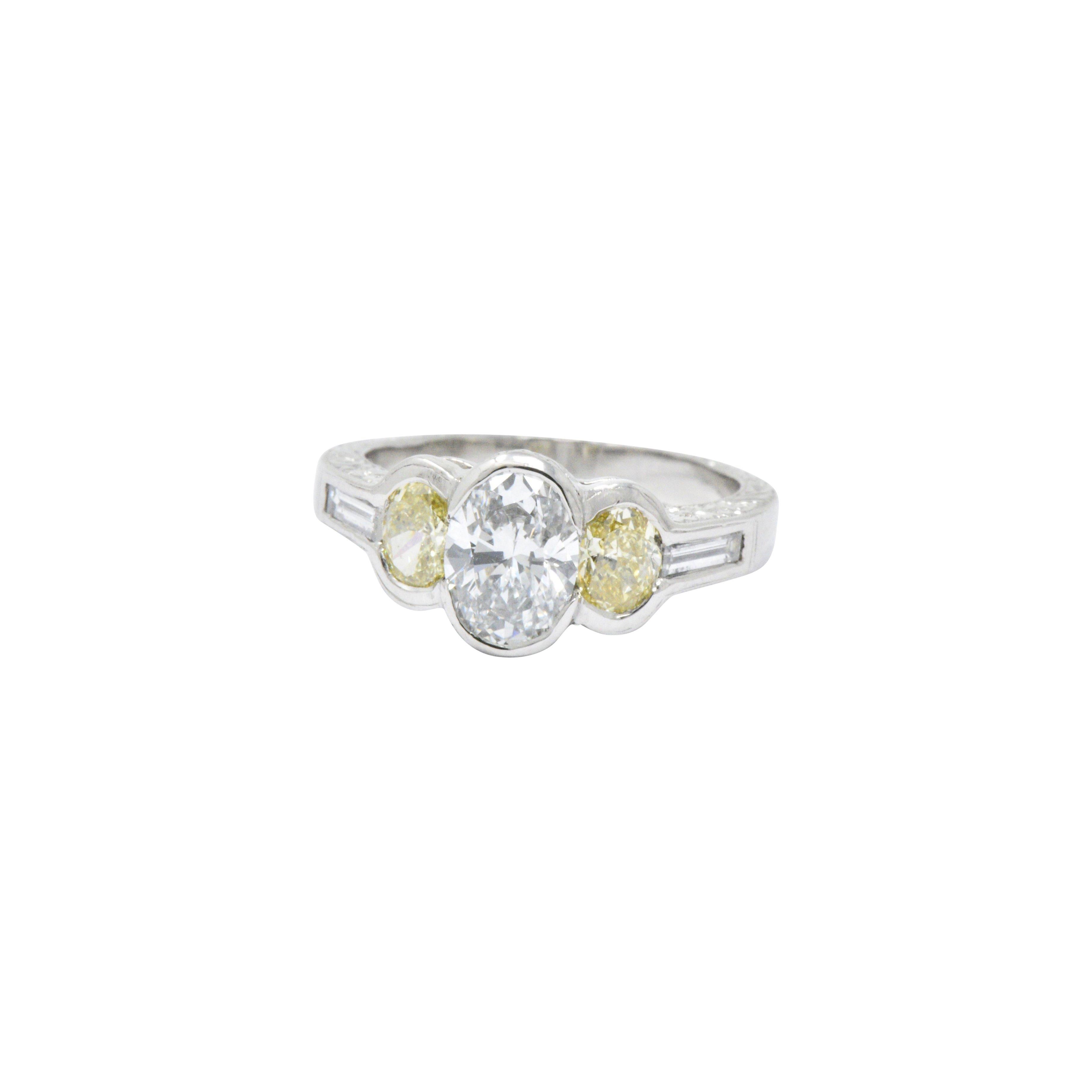 2.03 Carat Total Weight Oval Diamond Fancy Yellow Diamond Platinum Ring In Excellent Condition In Philadelphia, PA