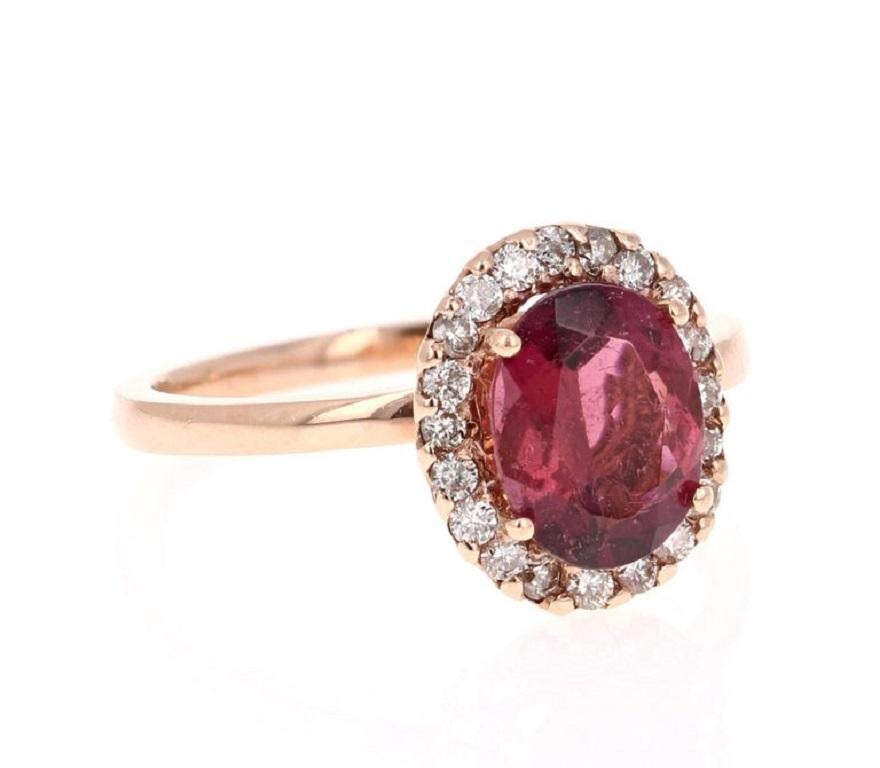 Wow! Beautiful and Radiant Pink Tourmaline Ring in a gorgeous Rose Gold Setting.

This ring has a Oval Cut Pink Tourmaline that weighs 1.75 Carats. Floating around the tourmaline are 20 Round Cut Diamonds in a halo weighing 0.28 Carats. 
The total