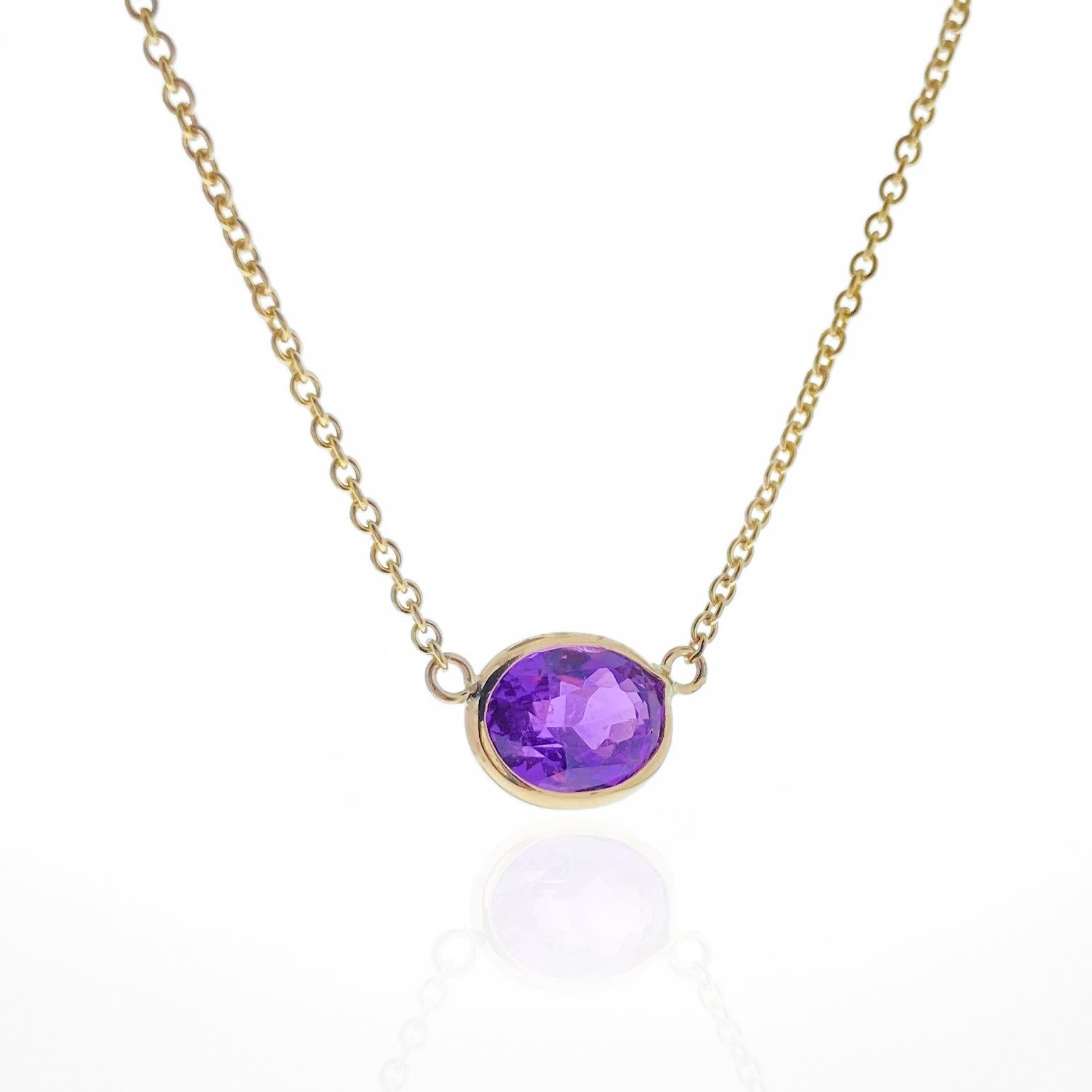 This necklace features an oval-cut purple sapphire with a weight of 3.15 carats, set in 14k yellow gold (YG). Purple sapphires are valued for their lovely purple hue, and the oval cut is a classic and elegant choice for gemstones, offering a