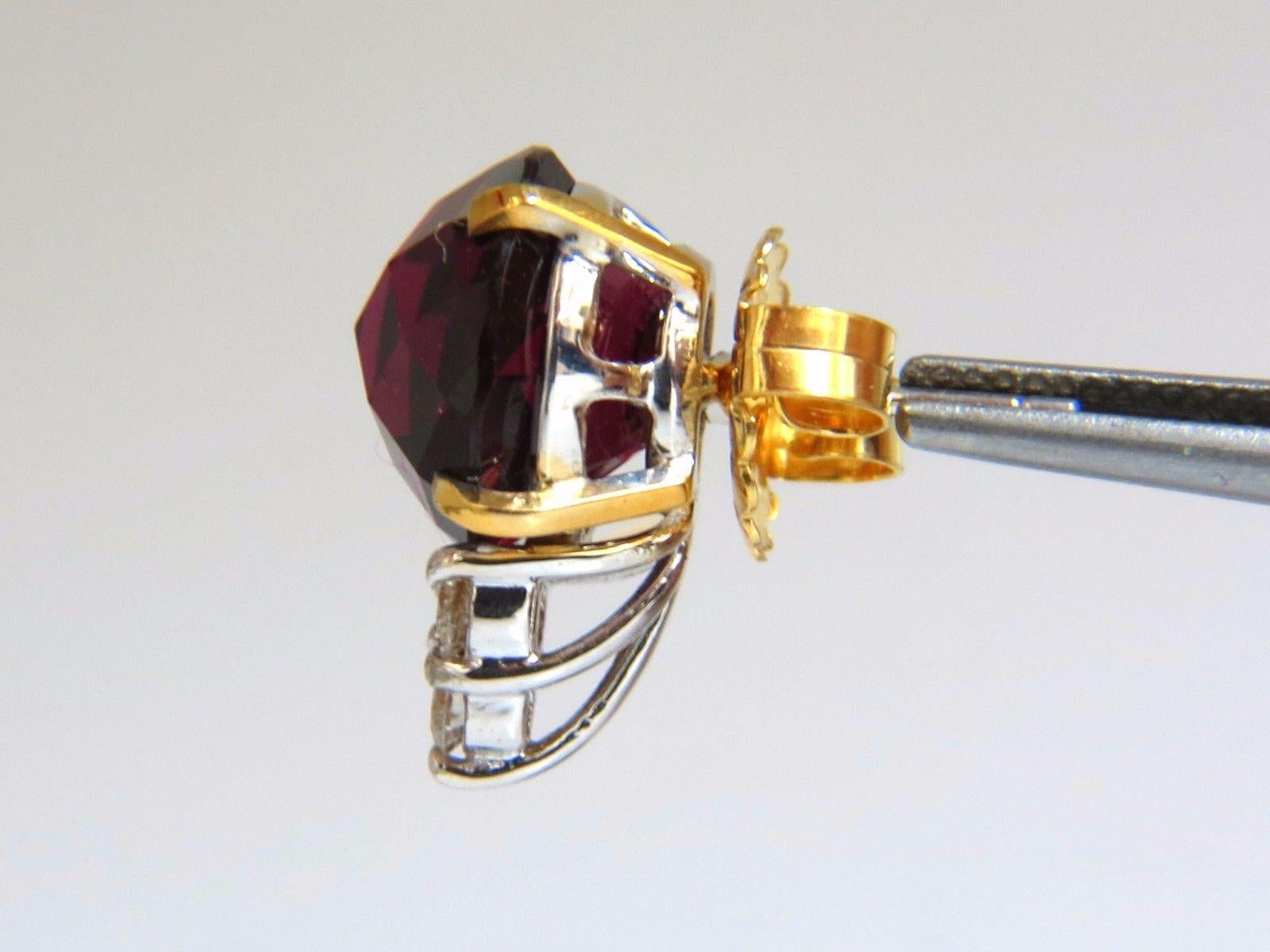 Victorian Revise.

19.76ct. Natural  Garnet earrings.

Rounds, rose cut:

11.9mm Diameter

 Transparent & clean clarity.

Bright shines of  vivid red flash.

.57cts of round diamonds: 

G-color, Vs-2 clarity.

14kt. yellow gold

8.8 grams.

Earrings