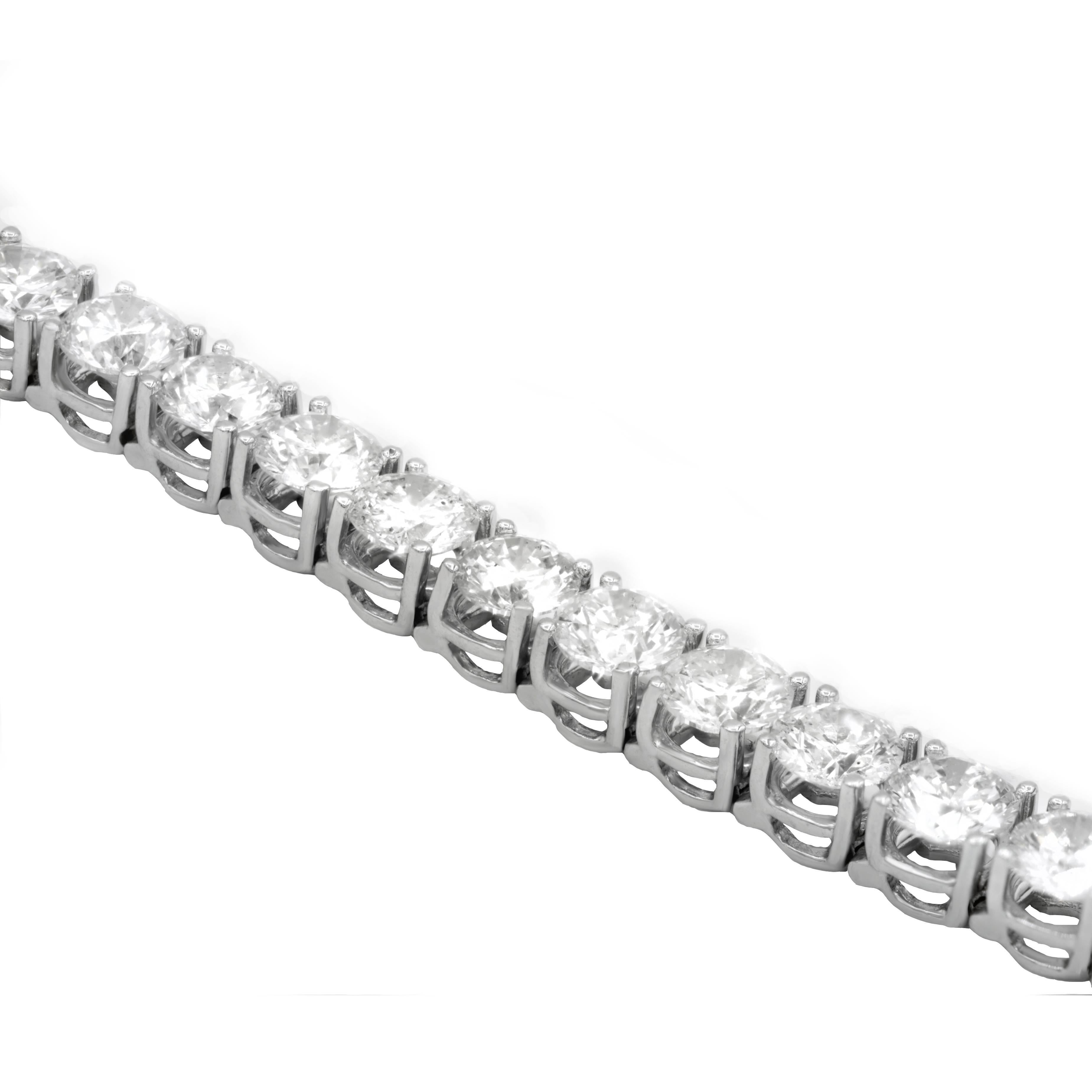 Classic four prong tennis bracelet consisting of 33 round brilliant cut diamonds,weighing 20.35 carats total GH color and slightly included clarity,set in 18 karat white gold mounting.