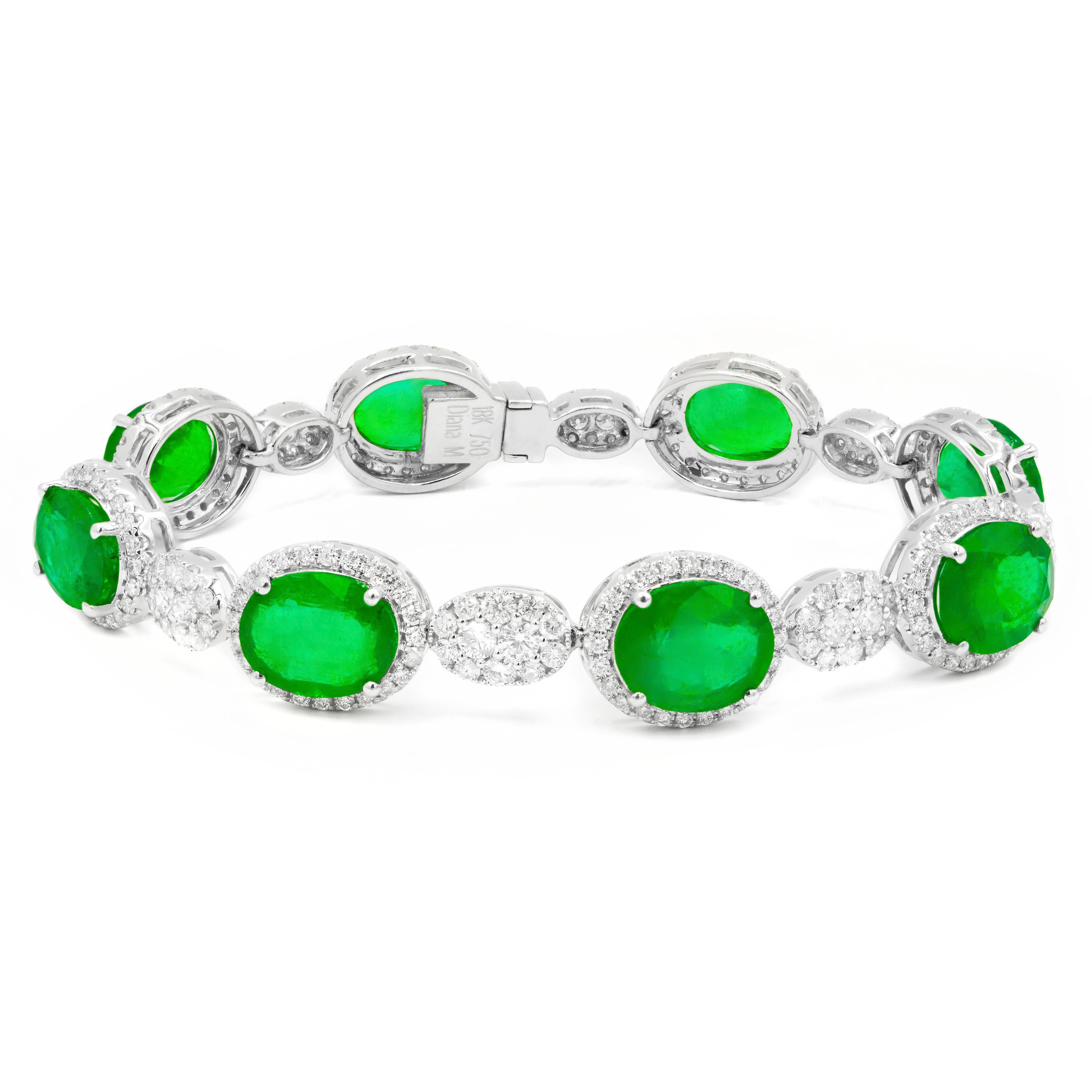 18 kt white gold emerald and diamond bracelet adorned with 20.37 cts tw of oval cut emeralds surrounded and separated by 4.22 cts tw of C.Dunaigre certified diamonds