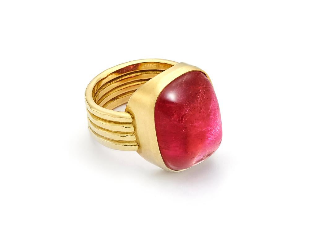 This gorgeous, 20.38 Carat cushion cut cabochon Rubellite hails from Africa and sits atop an 18 Karat Gold hand-hammered four band ring.

Ring size*: 8
*Ring can be resized upon request
