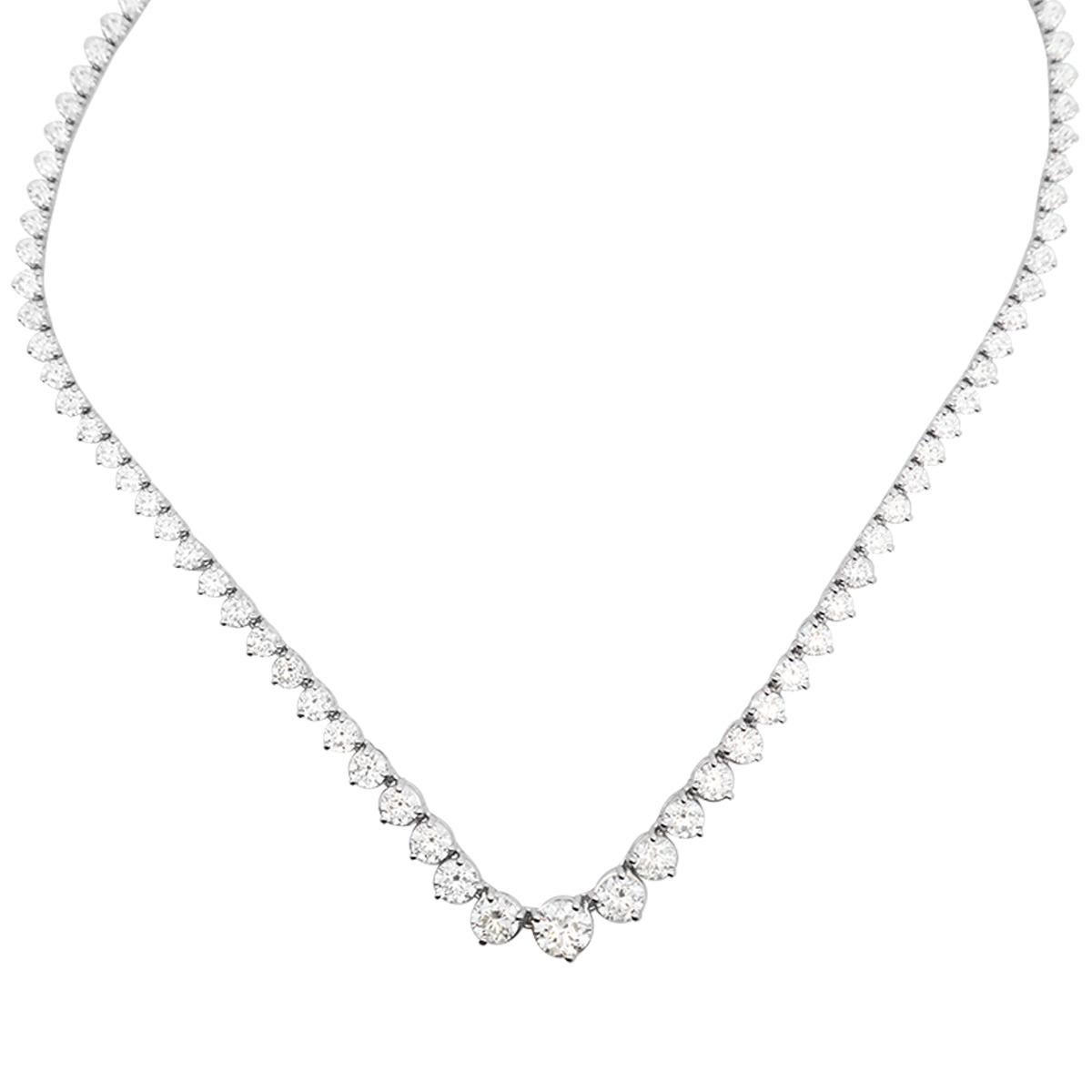 It's time to treat yourself to the one you've always wanted. Whether with a white tee or a gala dress this piece will impress. Our graduated tennis necklace made with 96 diamonds in a total of 20.38ct t.w round cut diamonds. Set in 18K White Gold.