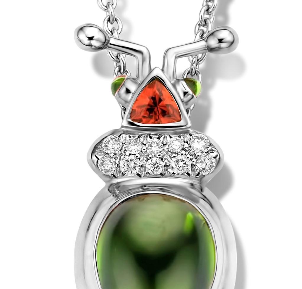One of a kind lucky beetle necklace in 18K white gold 10g set with the finest diamonds in brilliant cut 0,09Ct (VVS/DEF quality) and one natural, green tourmaline in pear cabouchon cut 2,03Ct. The head is set with a tsavorite in trillion cut and the