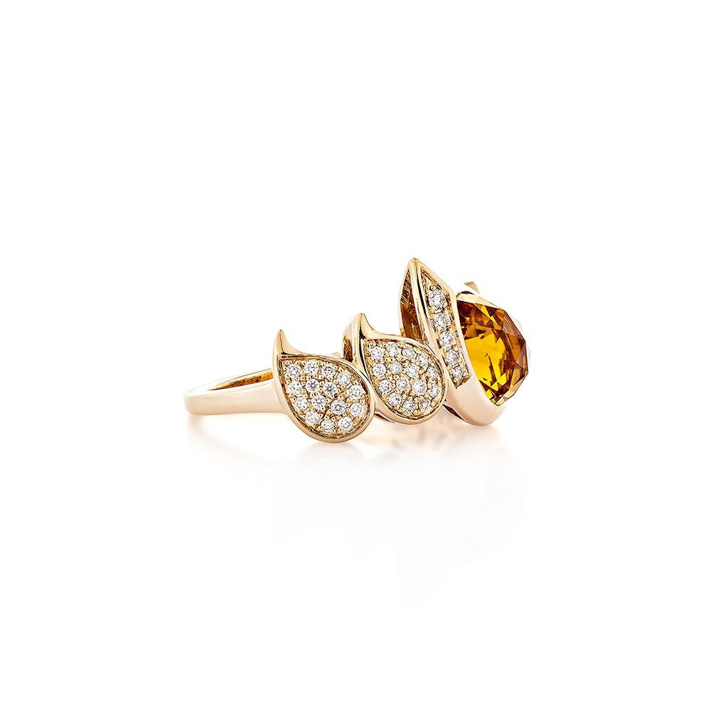 Presents a pear-shaped citrine ring with a briolette cut. Diamond has adorned the left and right sides of the center stone and ring are made of 18karat rose gold, which is very attractive and lovely.

Citrine Fancy Ring in 18Karat Rose Gold with