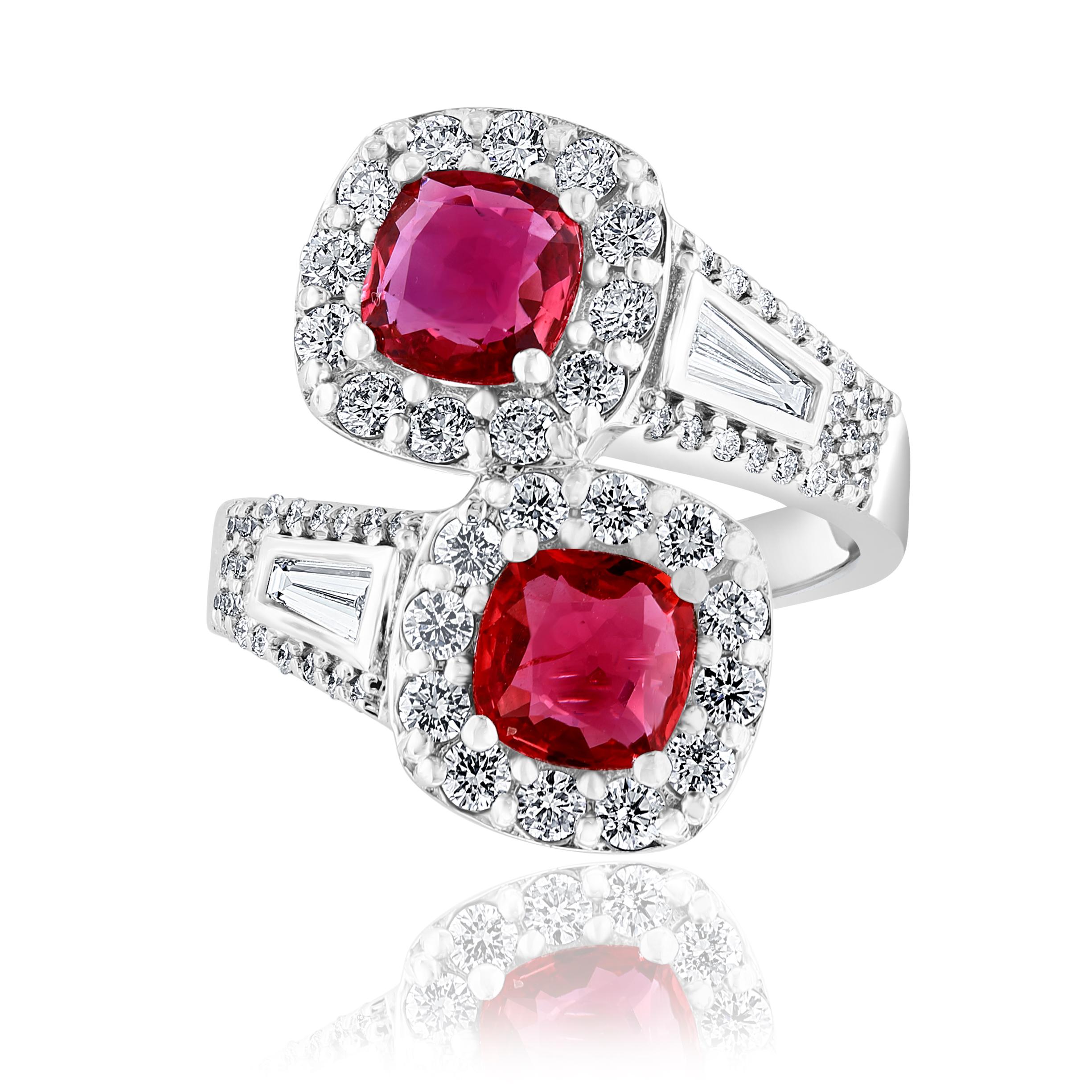 Exquisite 2 Stone Bypass Halo Ring with 2 Cushion Cut natural Rubies and 2 Tapered Baguette Diamonds surrounded by 86 round brilliant diamonds around the halo and down the sides. Rubies weigh 2.04 carats and  Diamonds weigh 0.88 carats