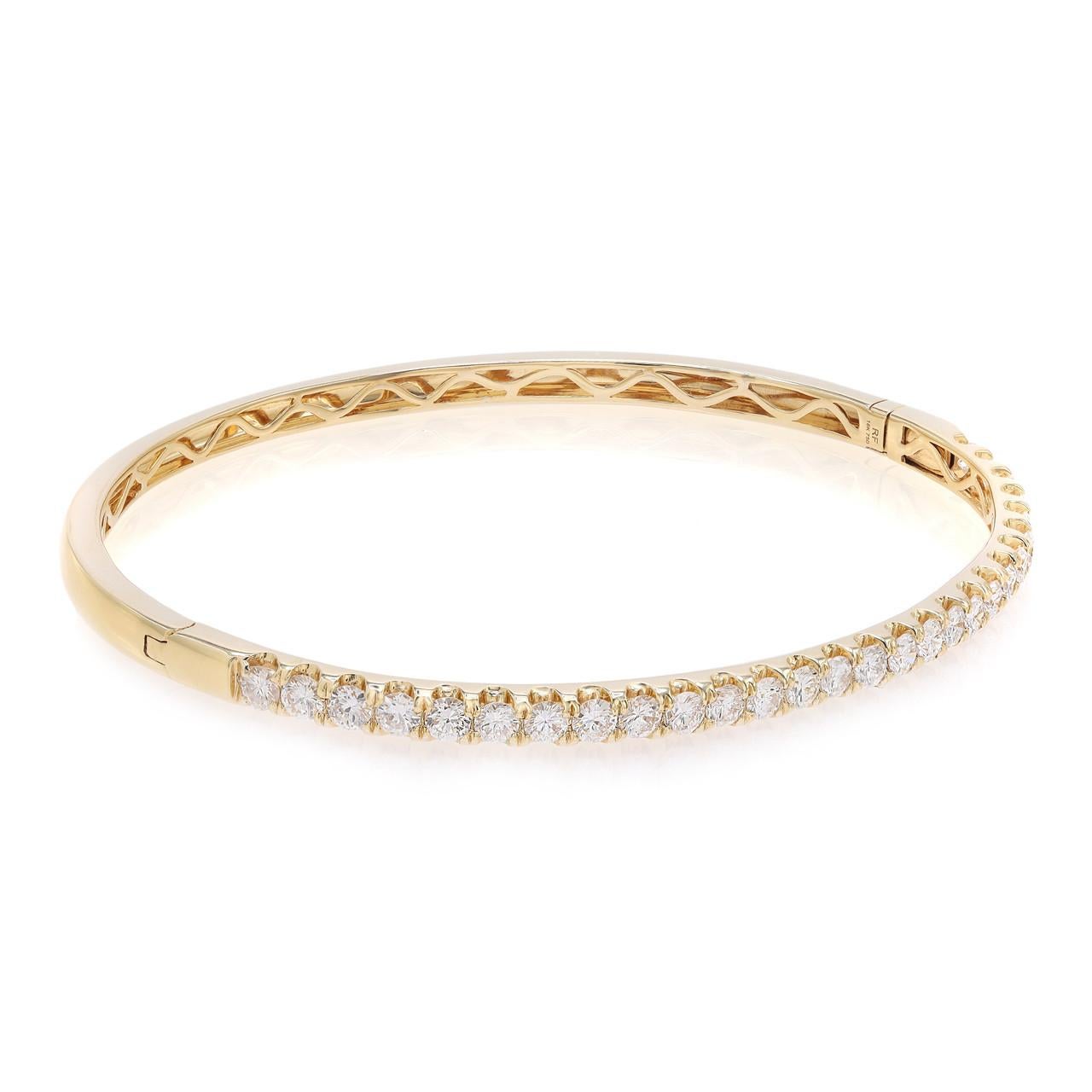 Introducing the versatile and elegant diamond bangle, a perfect blend of modernity and sophistication. This chic piece features over two carats of brilliant round diamonds, meticulously pavé set in 18k yellow gold. The lustrous yellow gold