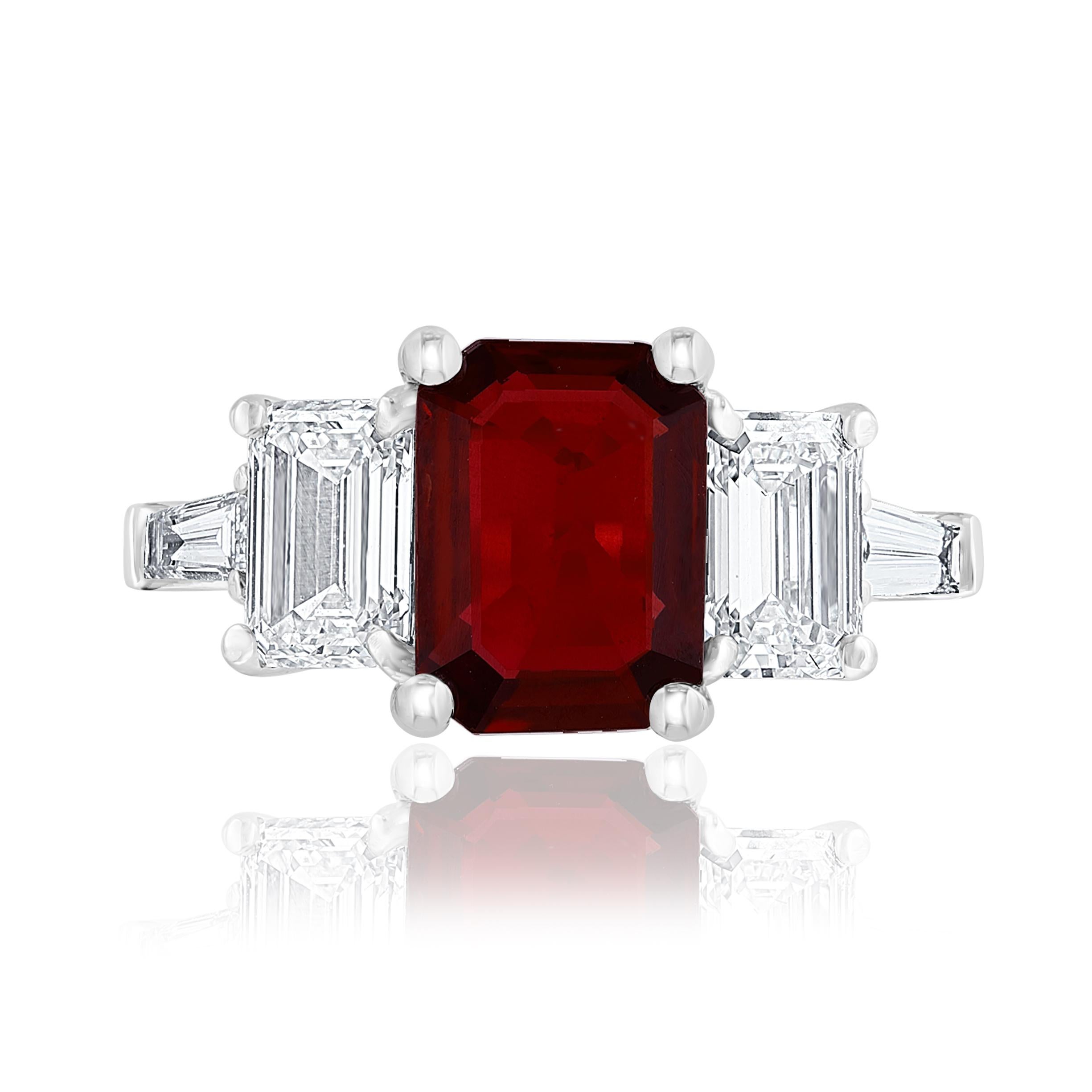Showcasing color-rich 2.04-carat natural rubies. Two perfectly matched baguette diamonds elegantly flank the center emerald cut ruby for a very classy and sophisticated piece. Additional 2 bullet cut diamonds channel set on a platinum composition. A